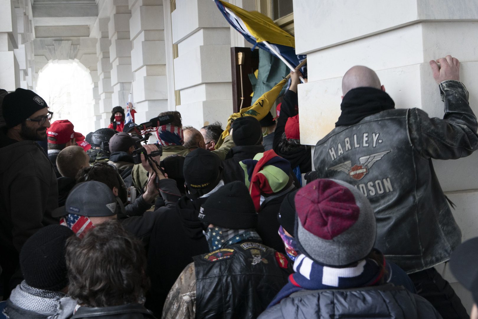 Demonstrators try to open a door of the U.S. Capitol on Wednesday, Jan. 6, 2021, in Washington.
