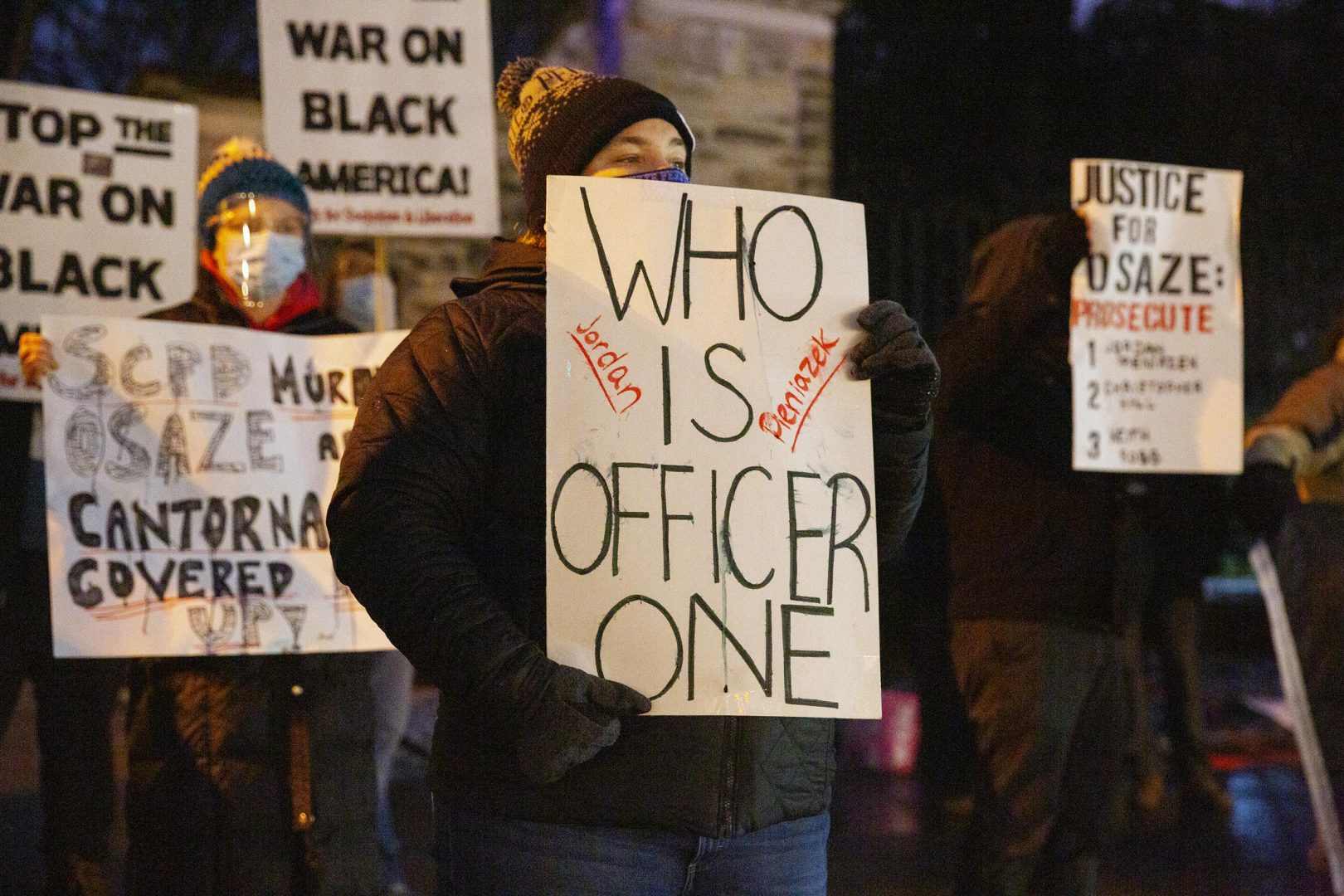 Protesters gathered in downtown State College Tuesday night to renew calls to remove three borough police officers involved in the killing of Osaze Osagie.