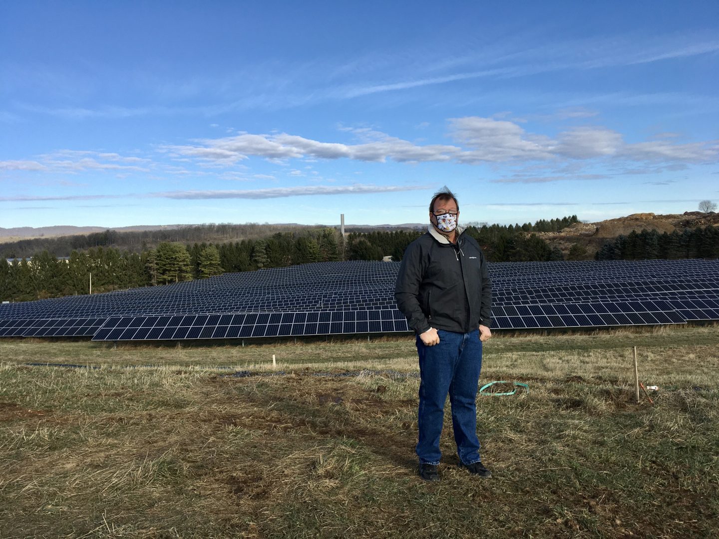 Cory Miller, executive director of the University Area Joint Authority, in the State College area of Centre County, standing in front of a UAJA solar panel project.