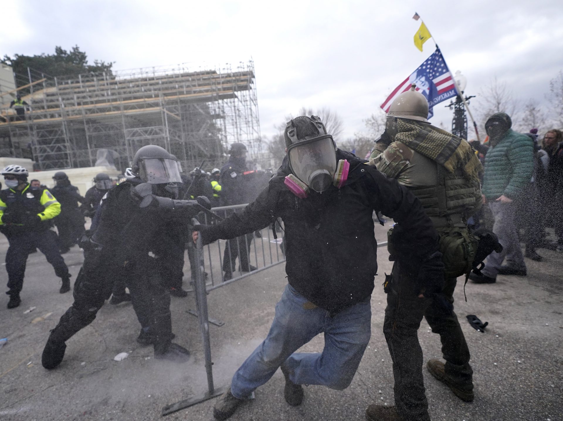 Trump supporters try to break through a police barrier, Wednesday, Jan. 6, 2021, at the Capitol in Washington. As Congress prepares to affirm President-elect Joe Biden's victory, thousands of people have gathered to show their support for President Donald Trump and his claims of election fraud.