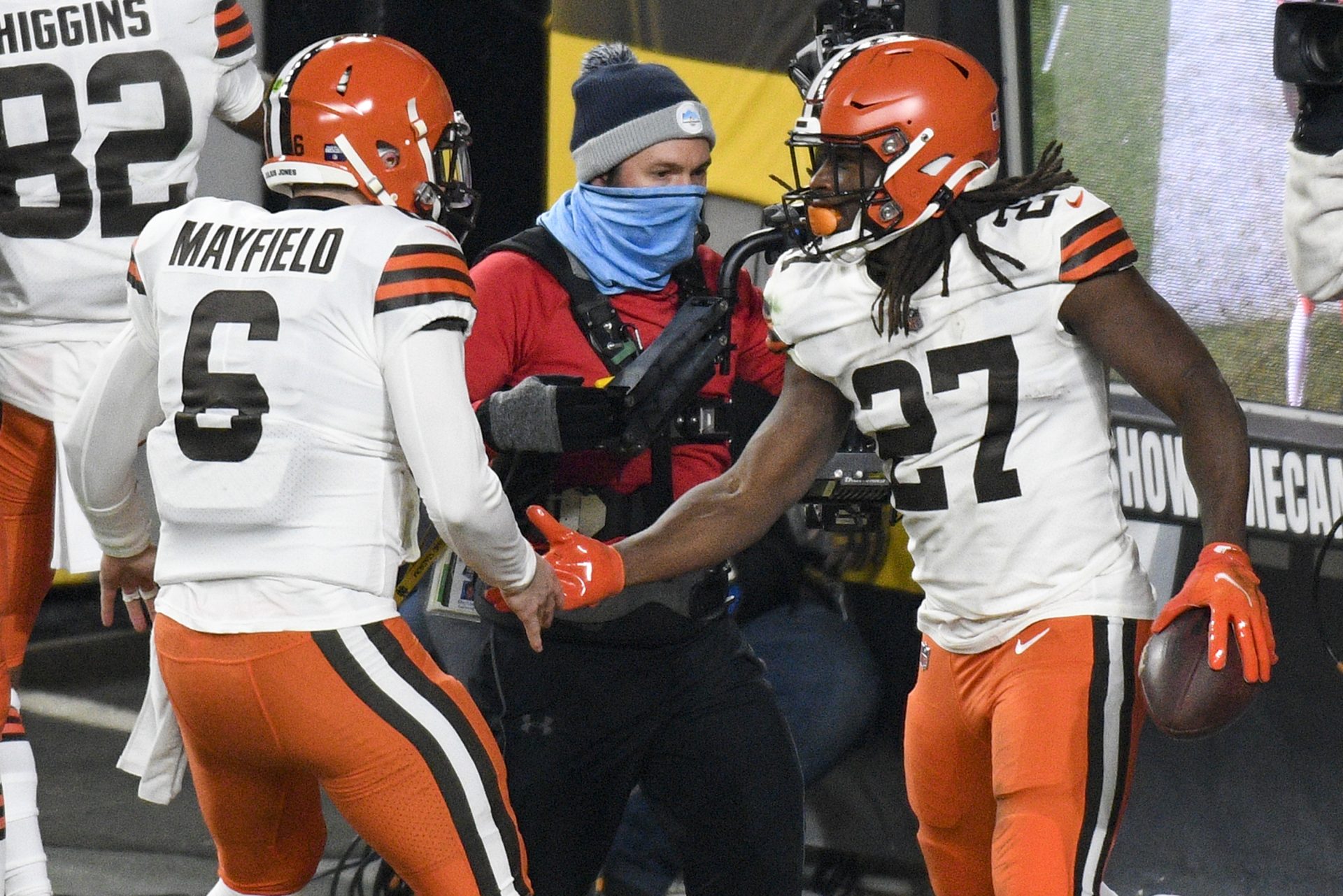 Cleveland Browns running back Kareem Hunt (27) celebrates with quarterback Baker Mayfield (6) after scoring on an eight-yard run during the first half of an NFL wild-card playoff football game against the Pittsburgh Steelers in Pittsburgh, Sunday, Jan. 10, 2021.