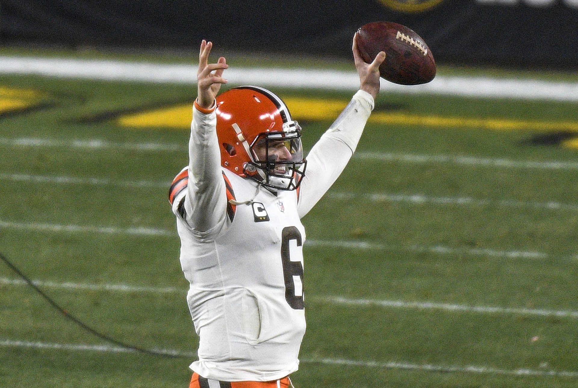 Cleveland Browns quarterback Baker Mayfield (6) celebrates as he walks off the field following a win over the Pittsburgh Steelers in an NFL wild-card playoff football game in Pittsburgh, Sunday, Jan. 10, 2021.