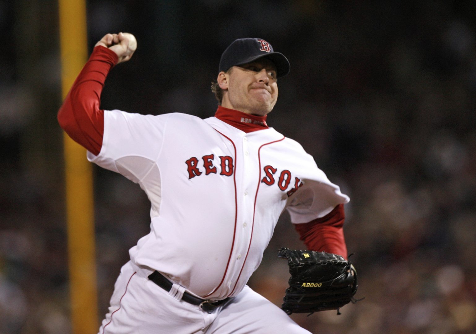 In this Oct. 25, 2007, file photo, Boston Red Sox's Curt Schilling pitches against the Colorado Rockies in Game 2 of the baseball World Series at Fenway Park in Boston. 