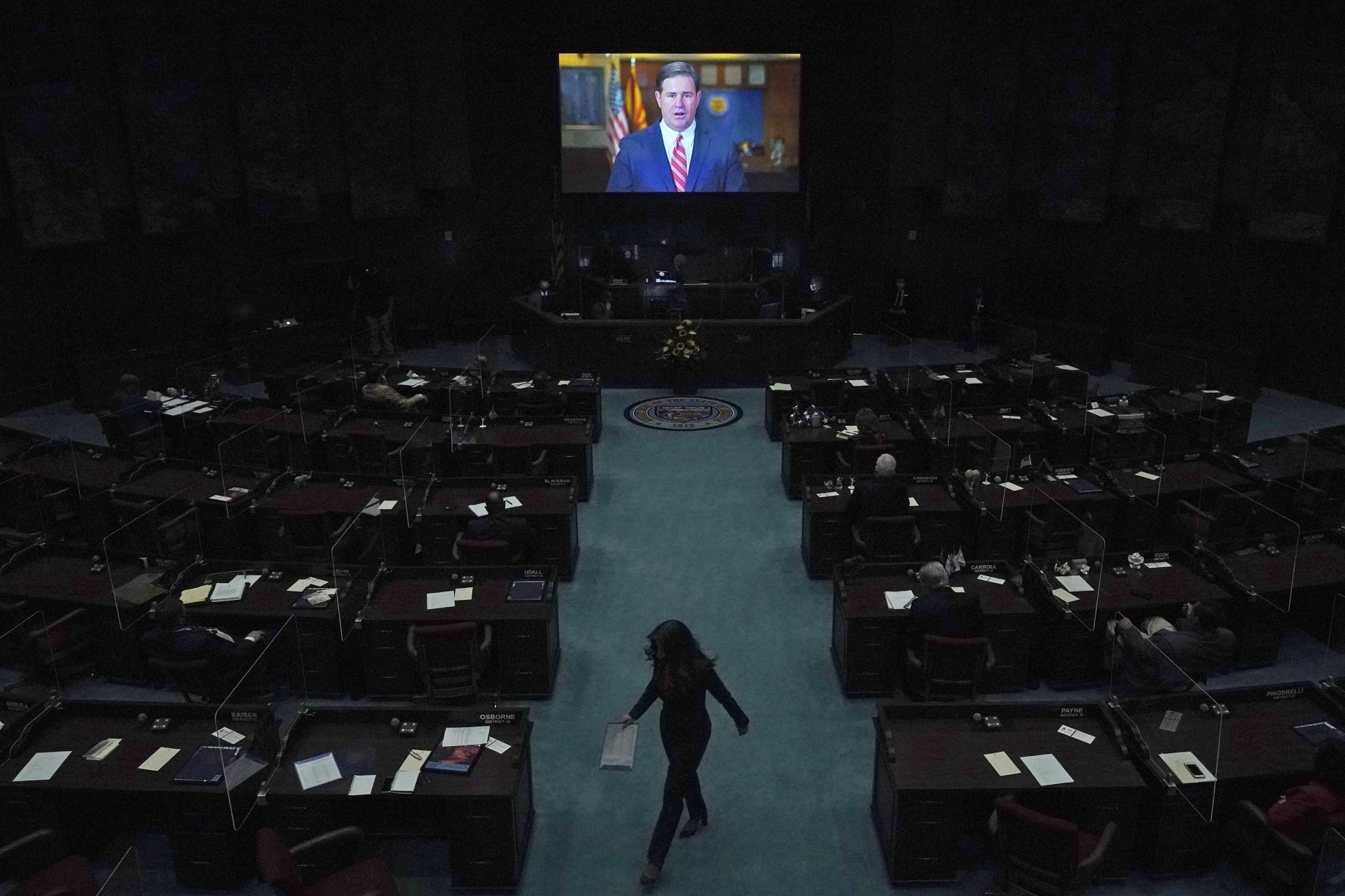 In this Jan. 11, 2021, file photo, Republican Gov. Doug Ducey delivers a remote state of the state address during the opening of the Arizona Legislature at the state Capitol in Phoenix. Irked by the sweeping use of executive orders during the COVID-19 crisis, state lawmakers around the U.S. are moving to curb the authority of governors and top health officials to impose emergency restrictions such as mask rules and business shutdowns. Republicans in the Arizona Senate want to end the broad emergency powers that Ducey has used to limit large gatherings and business capacities.