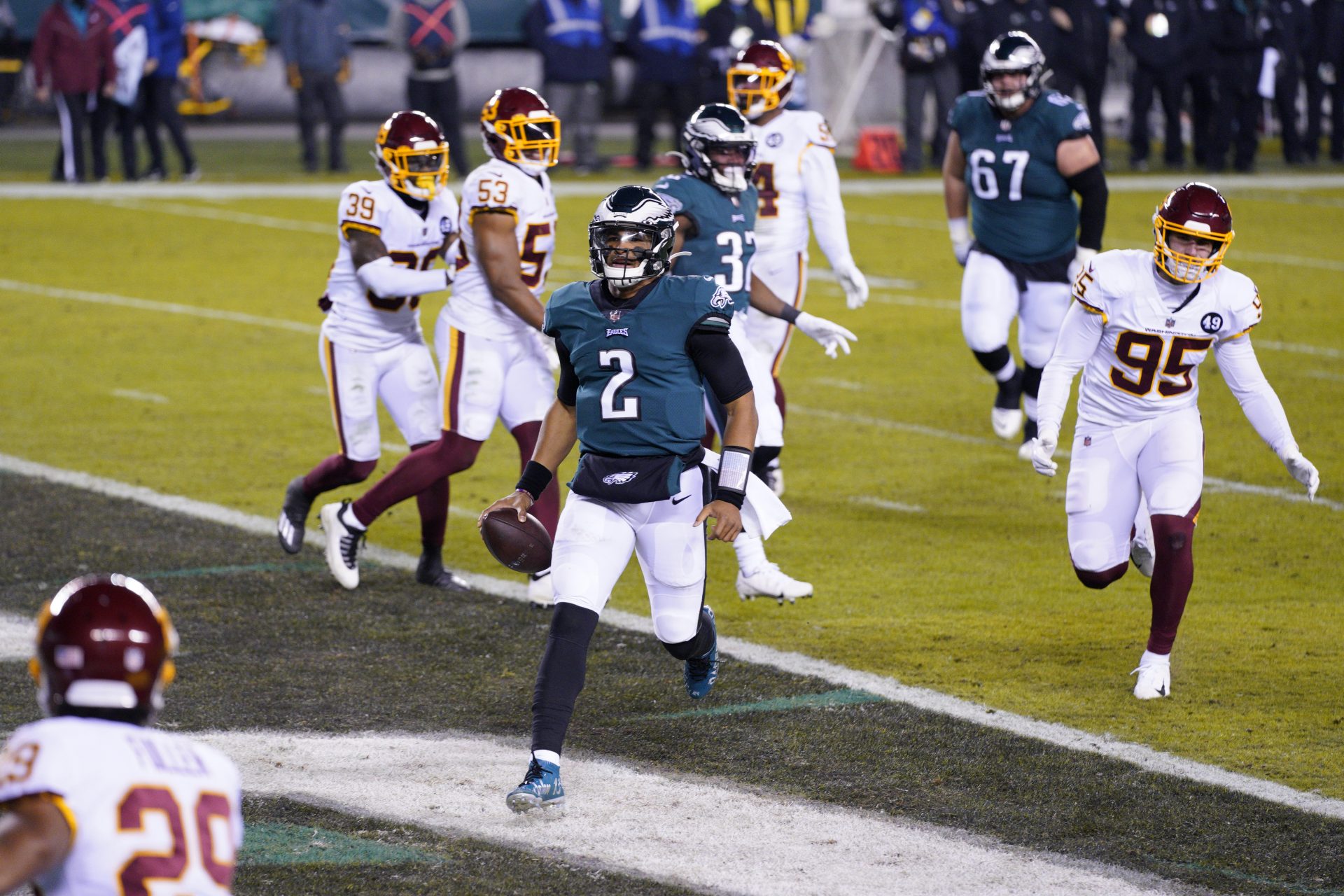 Philadelphia Eagles' Jalen Hurts (2) scores a touchdown during the first half of an NFL football game against the Washington Football Team, Sunday, Jan. 3, 2021, in Philadelphia.