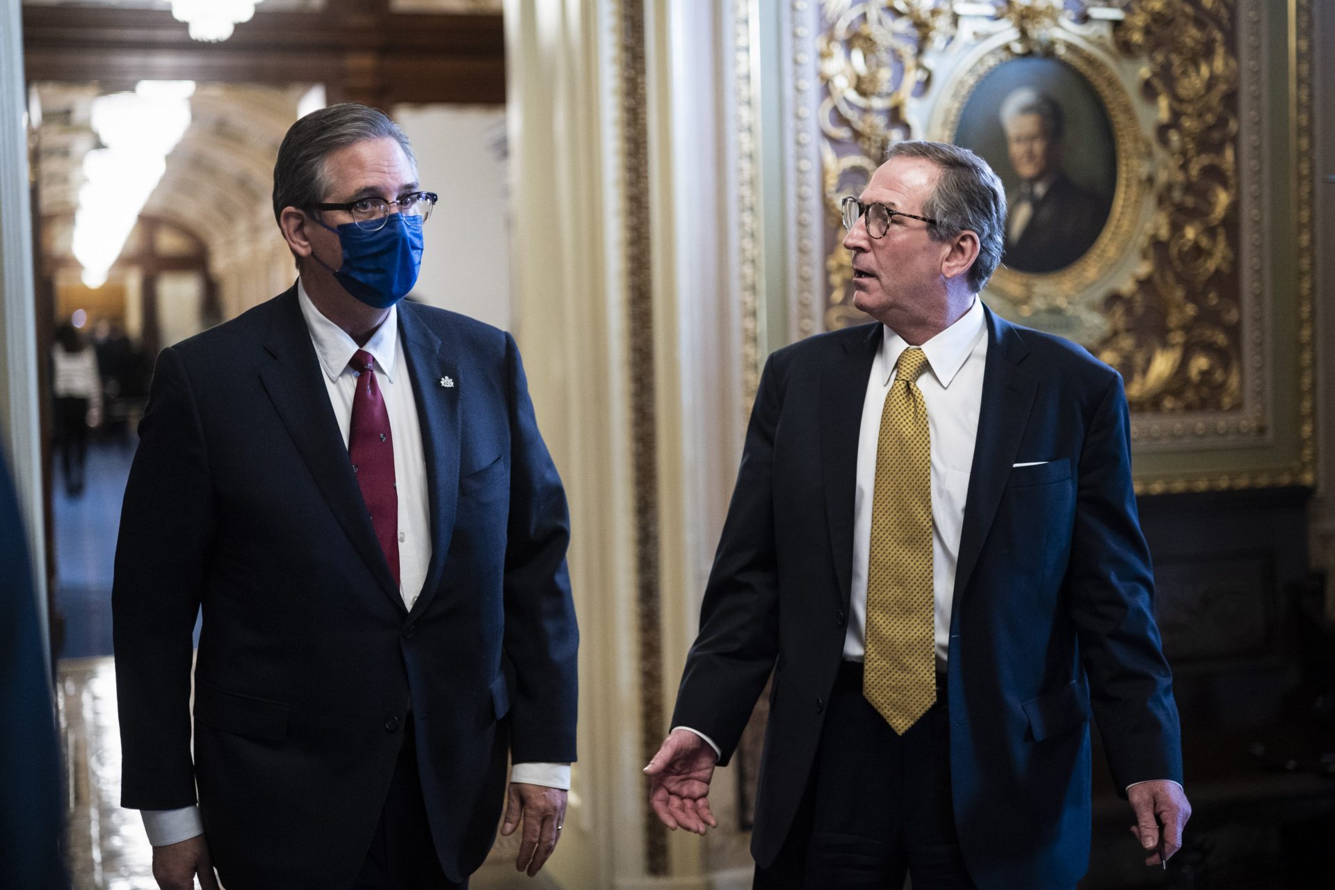 Bruce Castor and Michael van der Veen, lawyers for former President Donald Trump, walk back to their meeting room during a break through the Senate Reception room in the Capitol on the fourth day of the Senate Impeachment trials for former President Donald Trump on Capitol Hill, Friday, Feb 12, 2021 in Washington.
