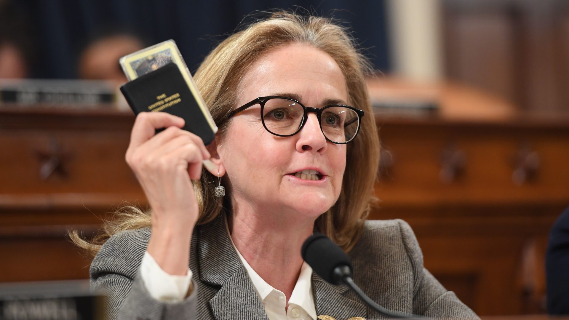 Rep. Madeleine Dean, D-Pa., holds a copy of the U.S. Constitution during a hearing related to former President Donald Trump's first impeachment in 2019.