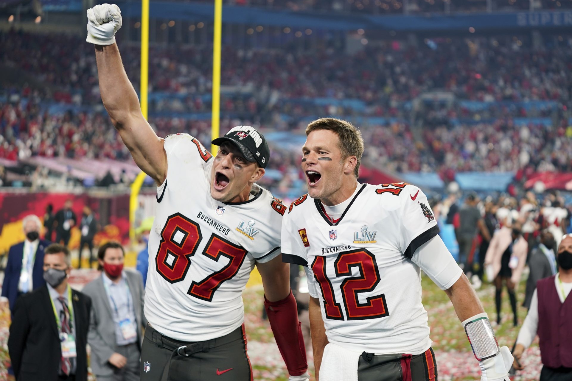 Tampa Bay Buccaneers tight end Rob Gronkowski (87), left, and Tampa Bay Buccaneers quarterback Tom Brady (12) celebrate together after the NFL Super Bowl 55 football game against the Kansas City Chiefs, Sunday, Feb. 7, 2021, in Tampa, Fla. The Tampa Bay Buccaneers defeated the Kansas City Chiefs 31-9.