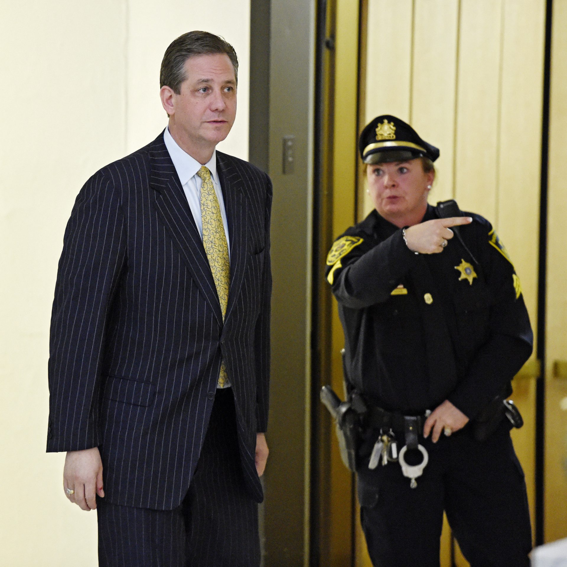 In this Feb. 2, 2016, file photo, former Montgomery County District Attorney Bruce Castor is directed to another elevator after taking the witness stand in a pretrial hearing for comedian Bill Cosby and his sexual assault case, as he leaves Montgomery County Courtroom A in Norristown, Pa.