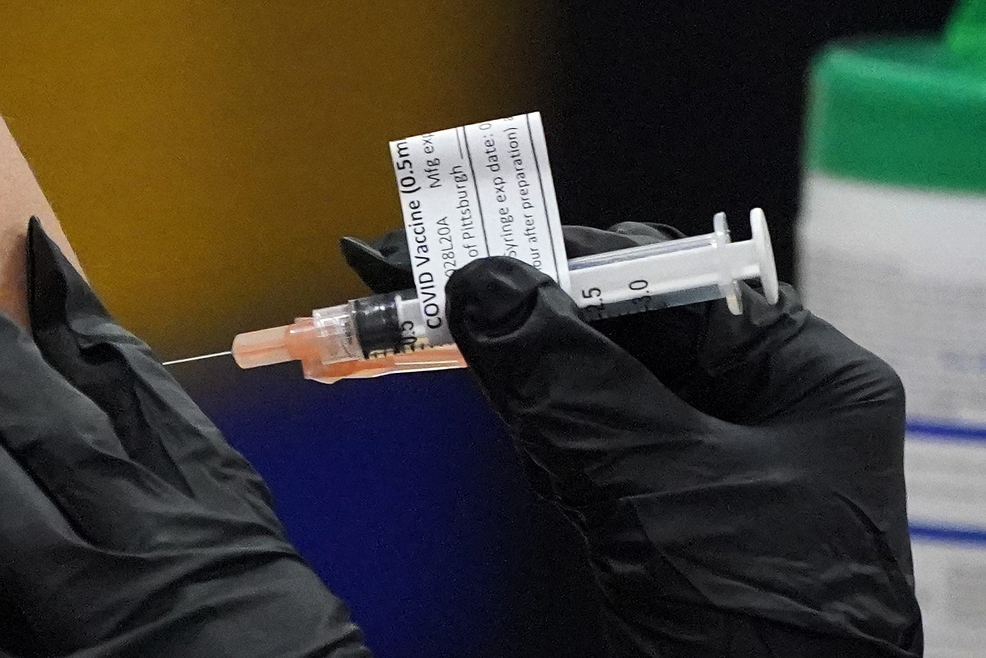 A student receives her first dose of the Moderna COVID-19 Vaccine during a vaccination clinic hosted by the University of Pittsburgh and the Allegheny County Health Department at the Petersen Events Center, in Pittsburgh, Thursday, Jan. 28, 2021.