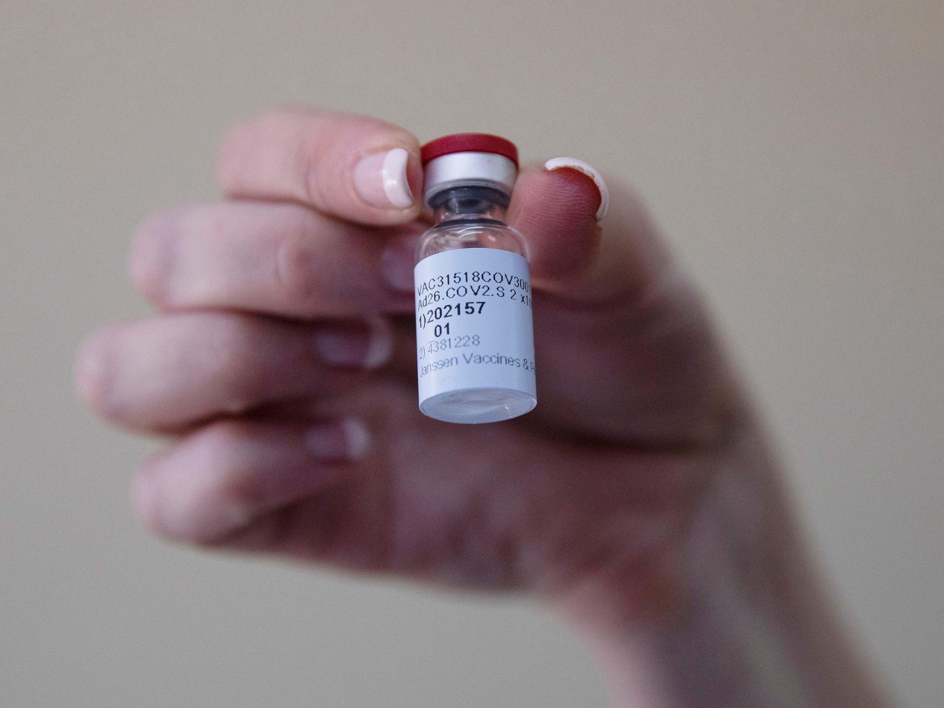 A health care worker holds a vial of the Johnson & Johnson COVID-19 vaccine at Klerksdorp Hospital in Klerksdorp, South Africa, on Feb. 18.