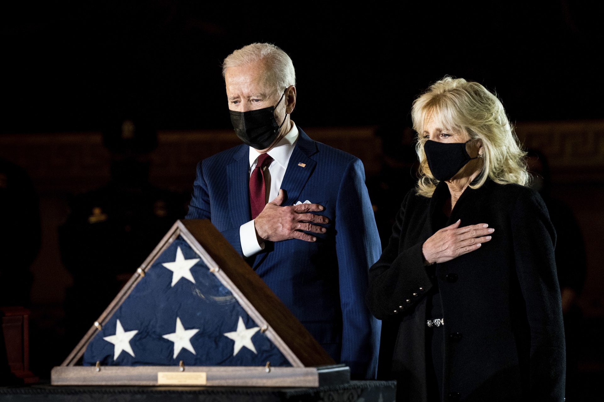 President Joe Biden and first lady Jill Biden pay their respects to the late U.S. Capitol Police officer Brian Sicknick as an urn with his cremated remains lies in honor on a black-draped table at the center of Capitol Rotunda, Tuesday, Feb. 2, 2021, in Washington.