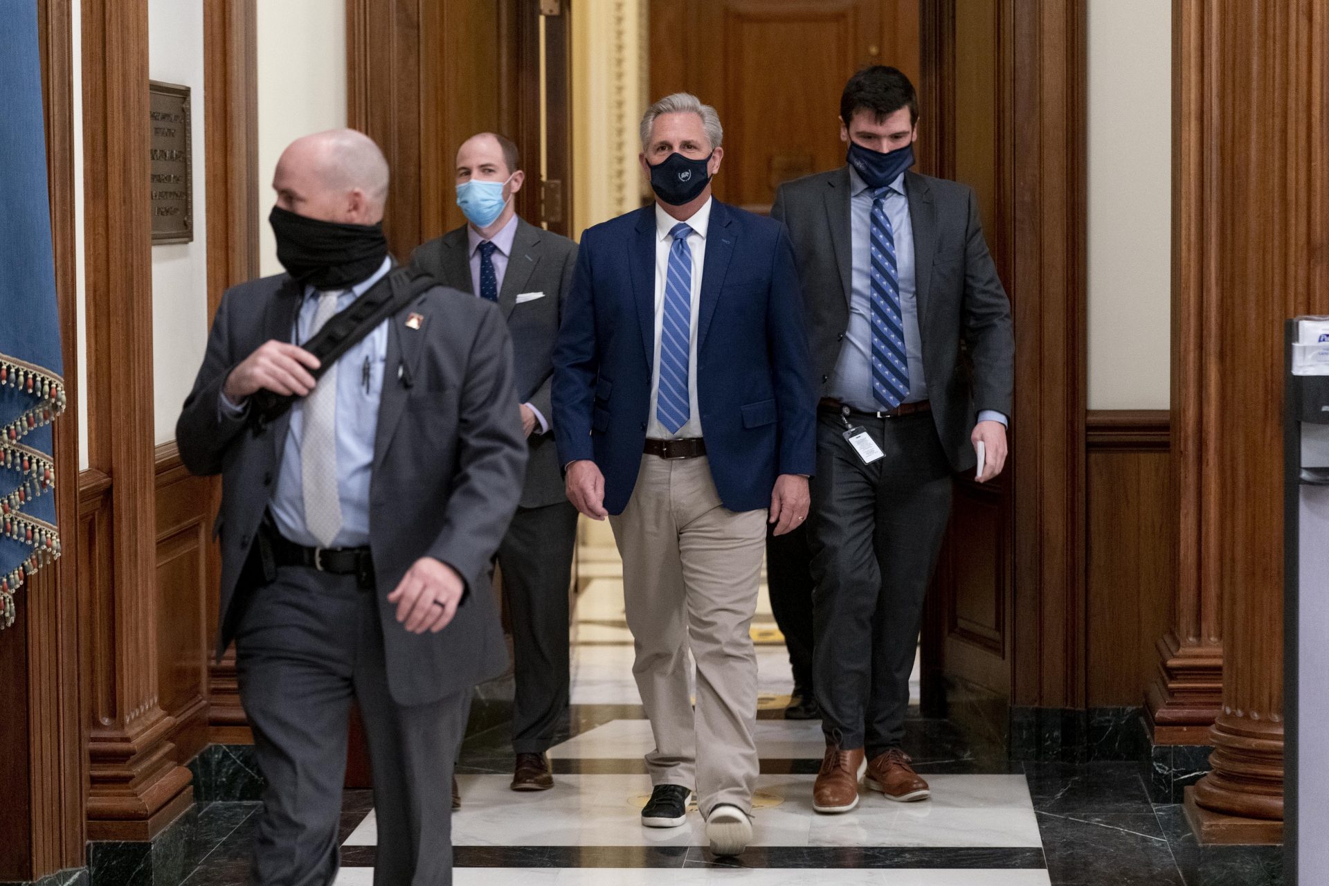 House Minority Leader Kevin McCarthy of Calif., leaves the House floor during a vote to remove Rep. Marjorie Taylor Greene, R-Ga., from committee assignments over her extremist views, on Capitol Hill in Washington, Thursday, Feb. 4, 2021.