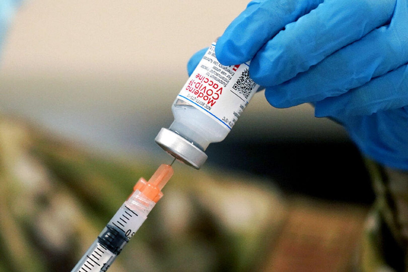 FILE PHOTO: Mississippi Air Guard Tech. Sgt. Exstrella Smith withdraws a dose of the Moderna COVID-19 vaccine for injection on Wednesday, Dec. 23, 2020, in Flowood, Miss. 