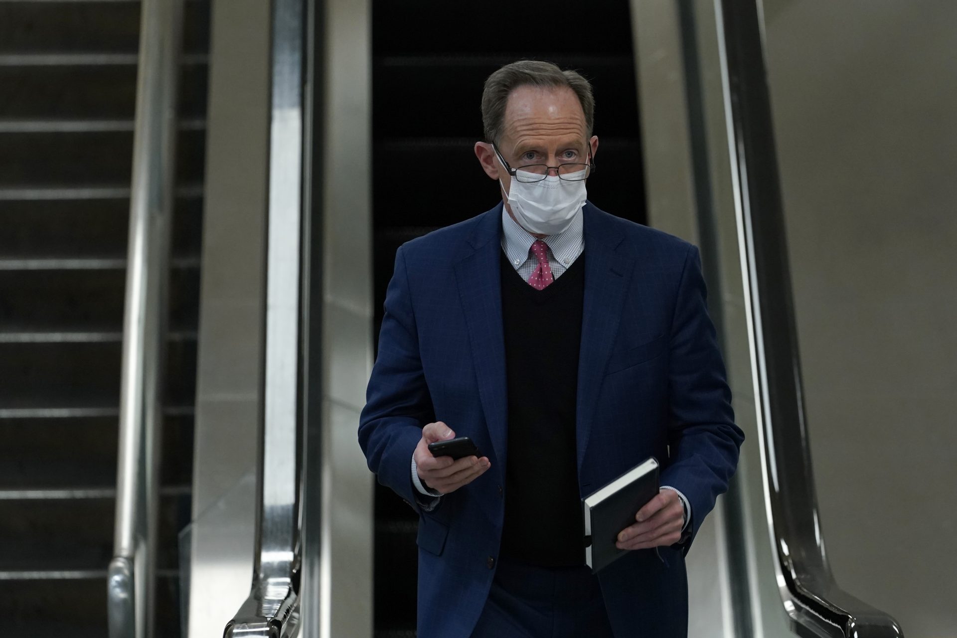 Sen. Pat Toomey, R-Pa., walks on Capitol Hill in Washington, Thursday, Feb. 11, 2021, after the third day of the second impeachment trial of former President Donald Trump.