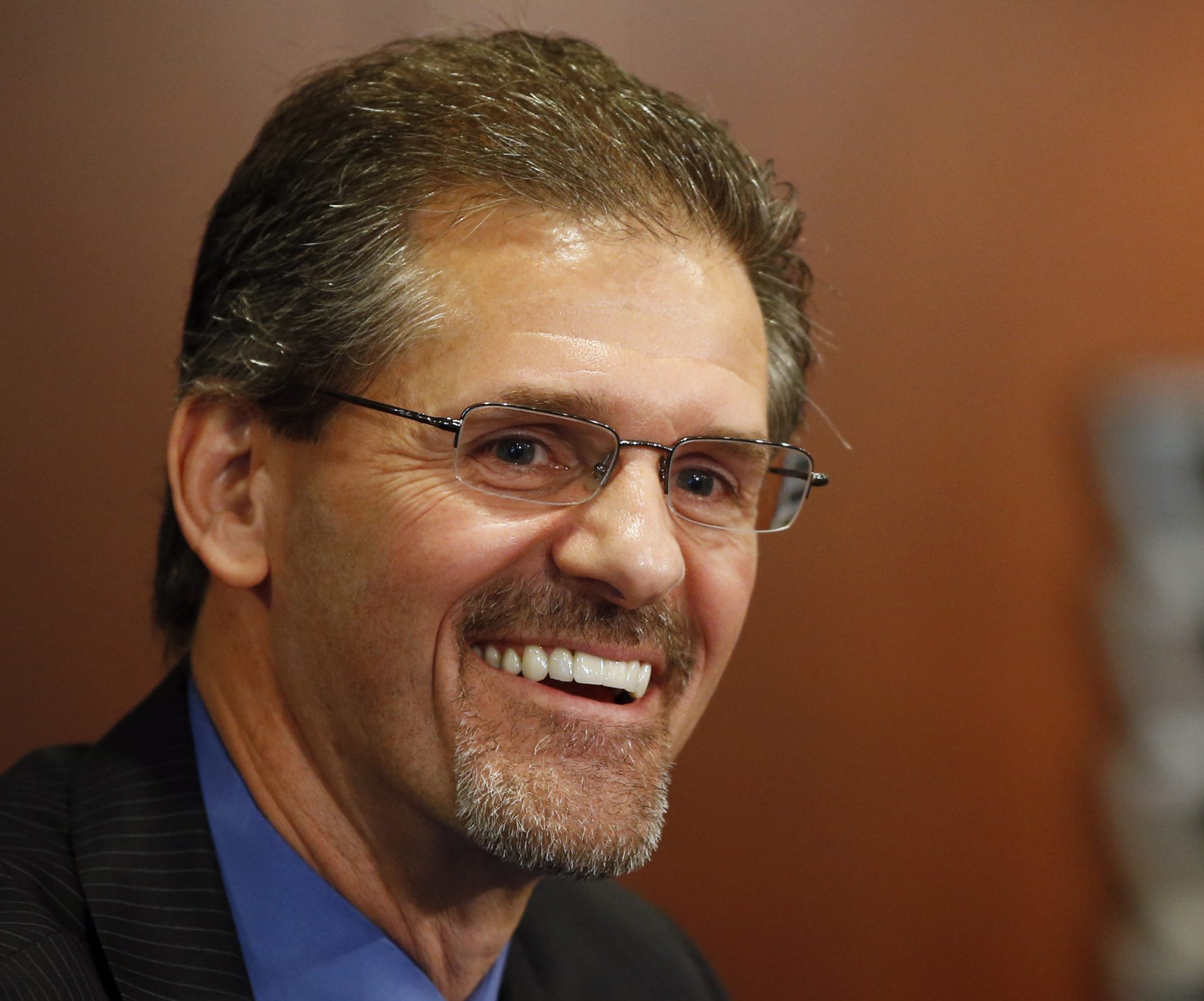 In this May 7, 2014, file photo, Philadelphia Flyers general manager Ron Hextall laughs during an NHL hockey news conference in Philadelphia. Mario Lemieux and the Pittsburgh Penguins are turning to a former rival to help them keep the Stanley Cup window open for Sidney Crosby and company. The team hired former Philadelphia Flyer goaltender and general manager Ron Hextall as the team's general manager on Tuesday, Feb. 9, 2021.