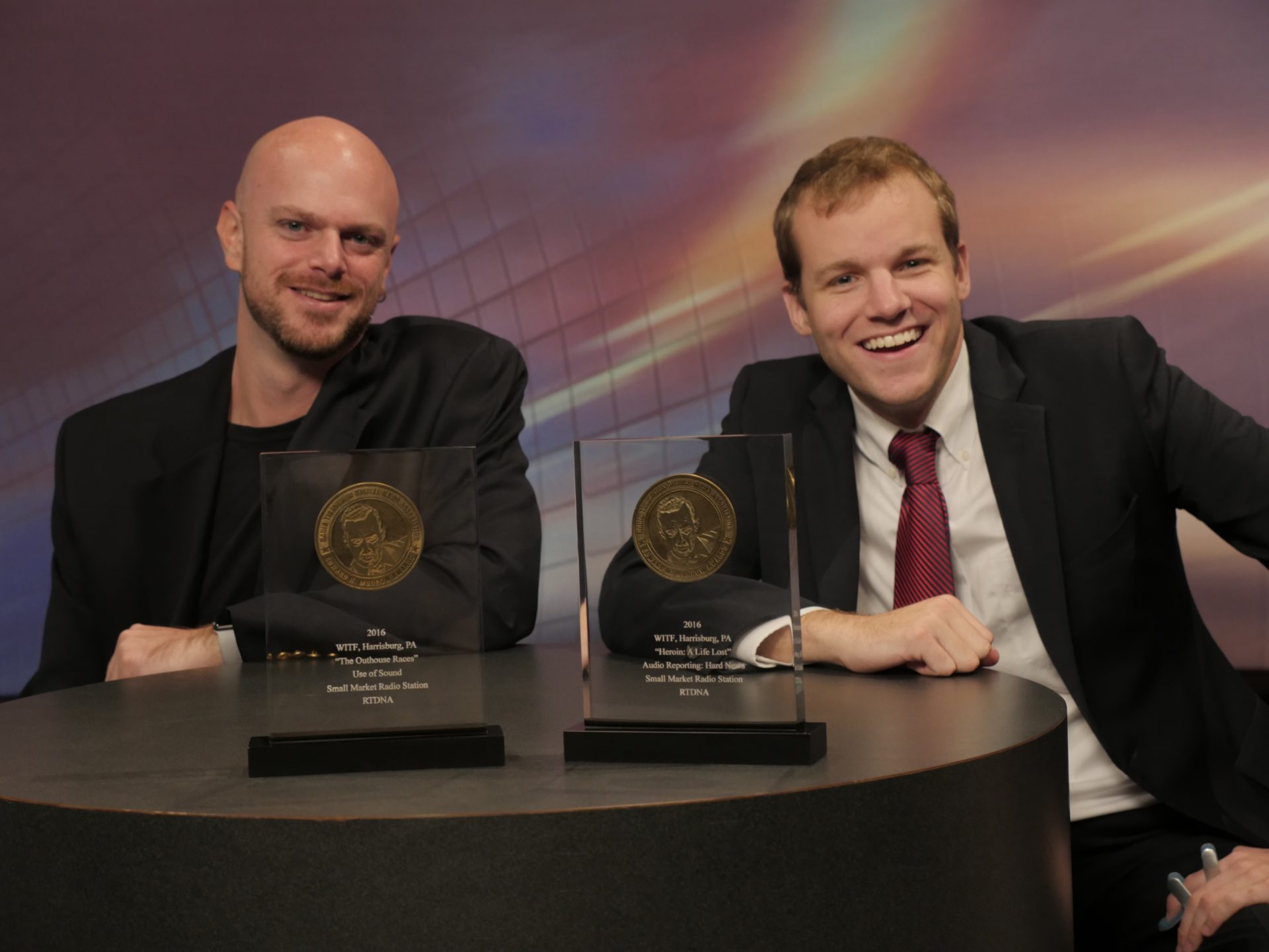 Joe Ulrich and Ben Allen pose with National Edward R. Murrow Award plaques recognizing their work in October 2016.