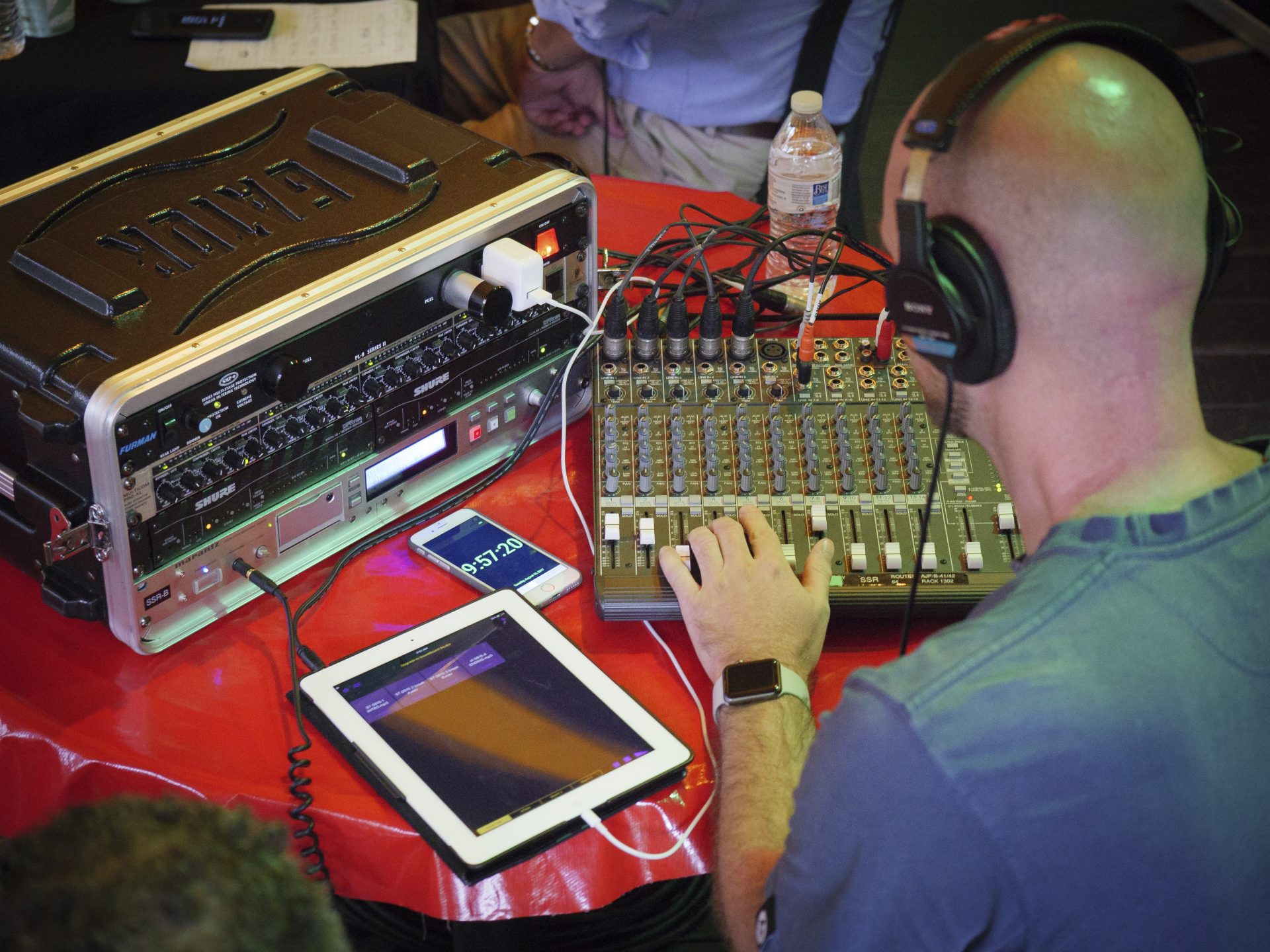 Joe Ulrich monitors the audio during a remote Smart Talk broadcast from the Jigger Shop in Mount Gretna on Aug. 15, 2017.