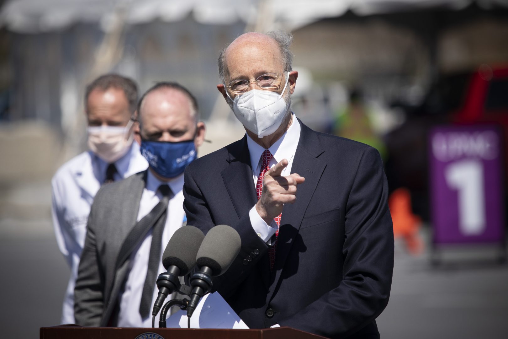 Pennsylvania Governor Tom Wolf speaking with the press during a visit to a drive-thru mass vaccination clinic for Dauphin County residents at Harrisburg Area Community College on March 30. 