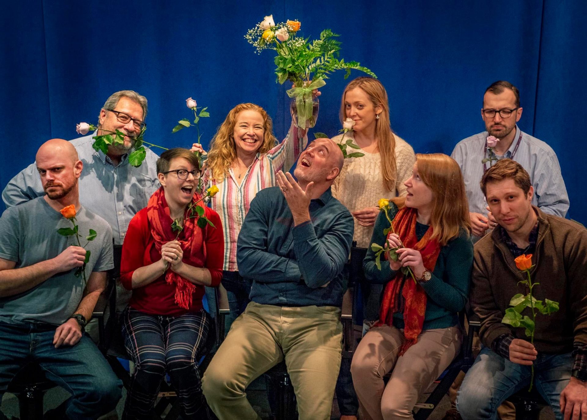 WITF staff pose with roses gifted to the newsroom in February 2020. Clockwise from top left: Scott LaMar, Cara Williams Fry, Emily Previti, Fred Vigeant, Brett Sholtis, Rachel McDevitt, Tim Lambert, Lisa Wardle and Joe Ulrich.