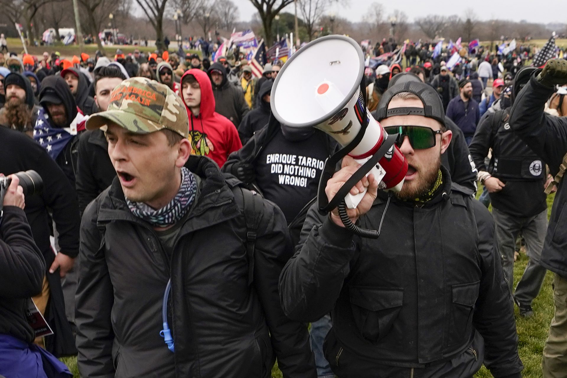 In this Jan. 6, 2021, photo, Proud Boys members Zachary Rehl, left, and Ethan Nordean, left, walk toward the U.S. Capitol in Washington, in support of President Donald Trump.