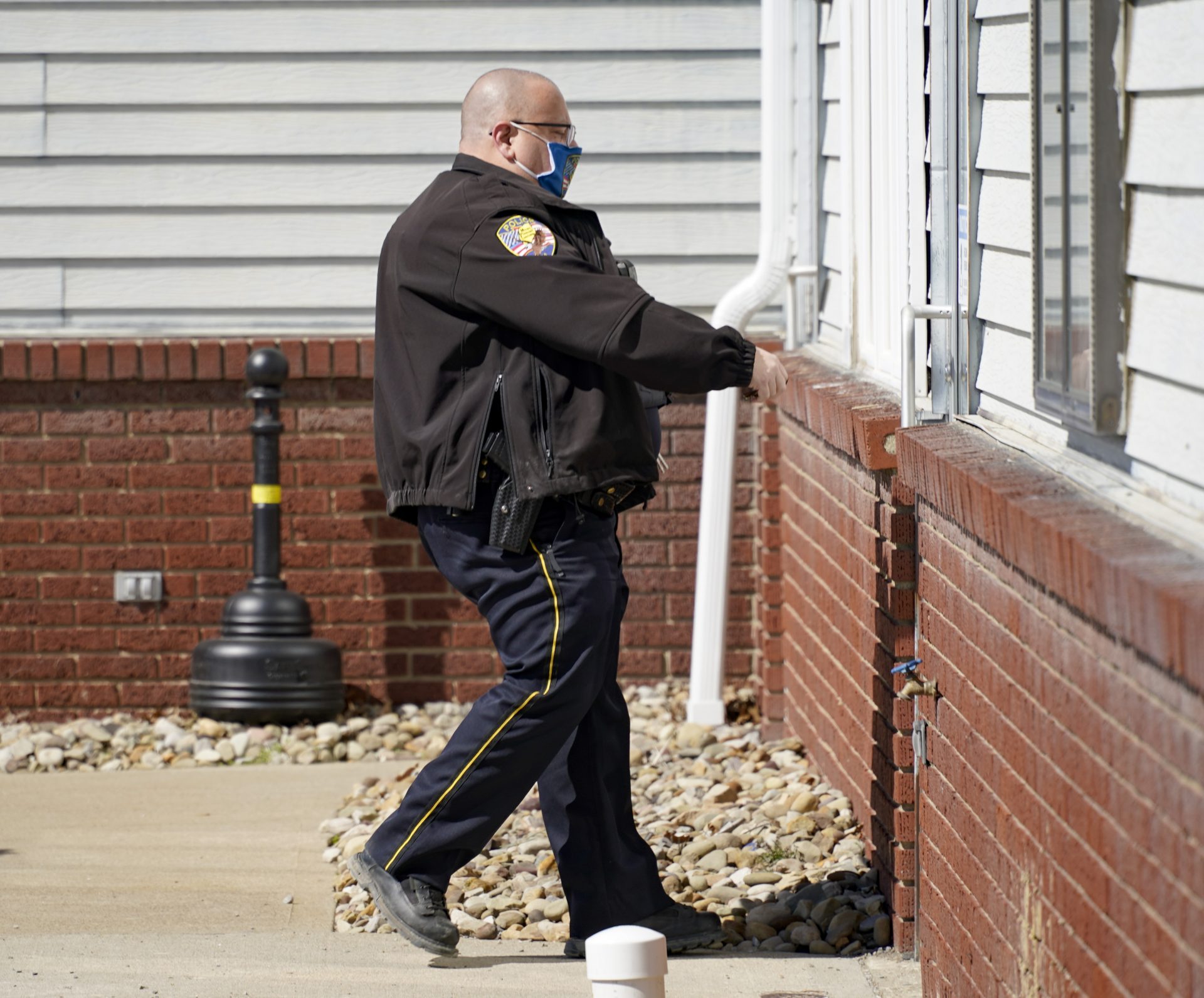 Mount Pleasant Township Police Chief Lou McQuillan returns to his office at the municipal building in Hickory, Pa., on Monday, March 15, 2021.