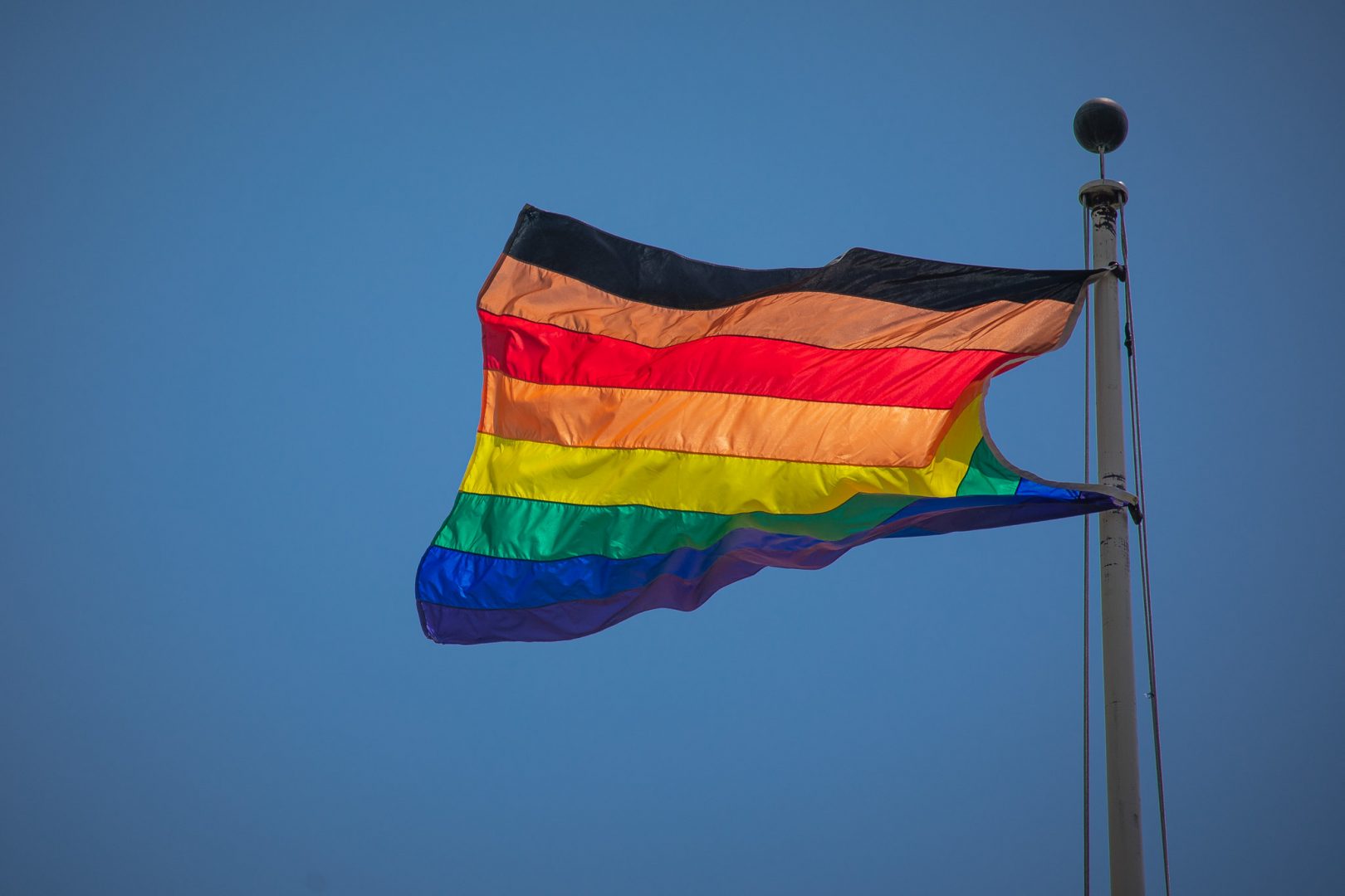 An LGBTQ pride flag flies at the Pennsylvania Capitol in June 2020.