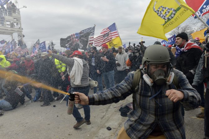 Pro-Trump extremists clashed with police during the storming of the U.S. Capitol on Jan. 6. The rioters may not have fired shots, but many were armed with other weapons, court documents show.