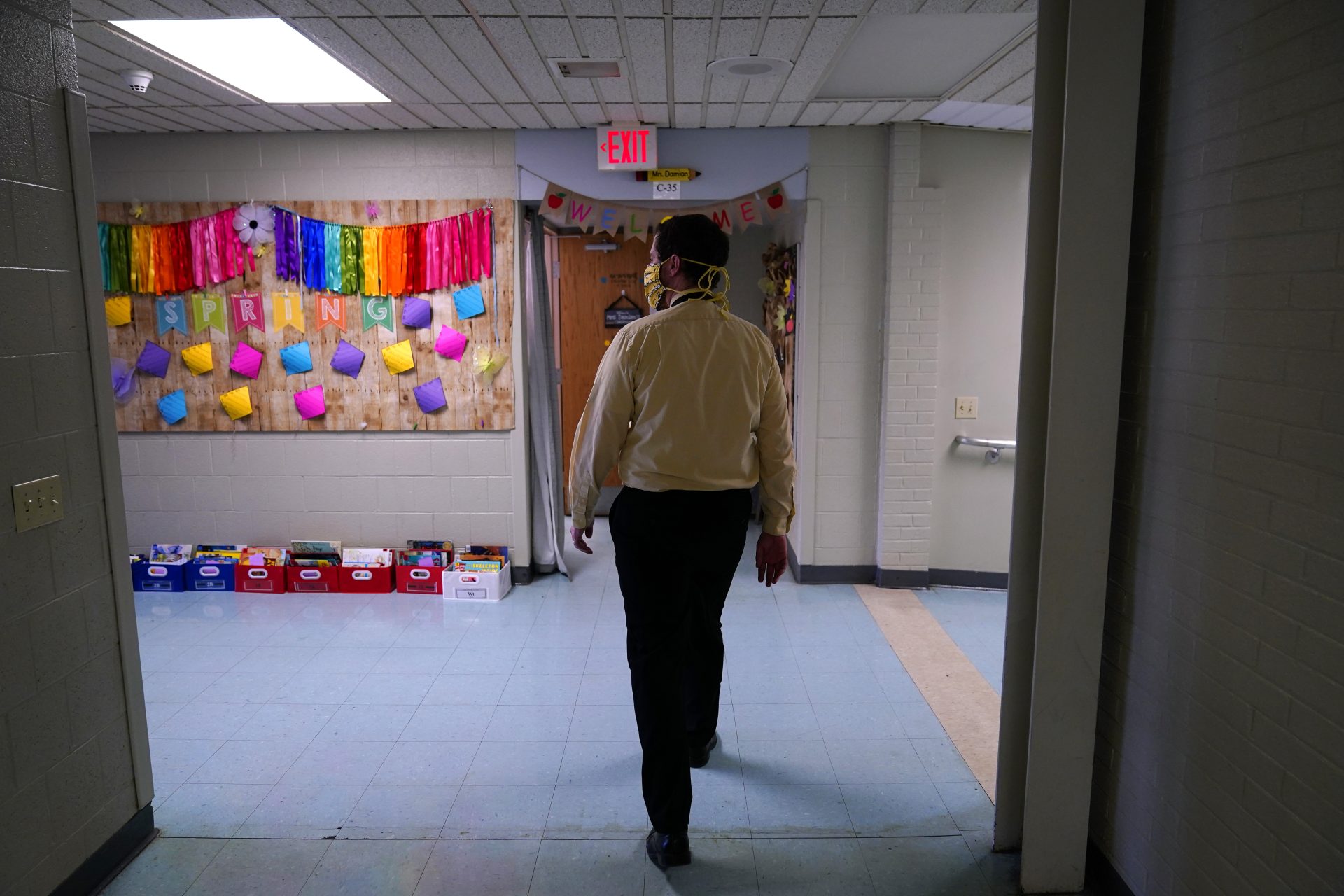 Principal Rob Palazzo walks down a hall at Panther Valley Elementary School, Thursday, March 11, 2021, in Nesquehoning, Pa. On May 26, 2020, former student, 9-year-old Ava Lerario; her mother, Ashley Belson, and Ava's father, Marc Lerario, were found fatally shot inside their home. Palazzo says he and the rest of the school and community are grappling with the what-ifs: What if school had been open, and they had a chance to save Ava?