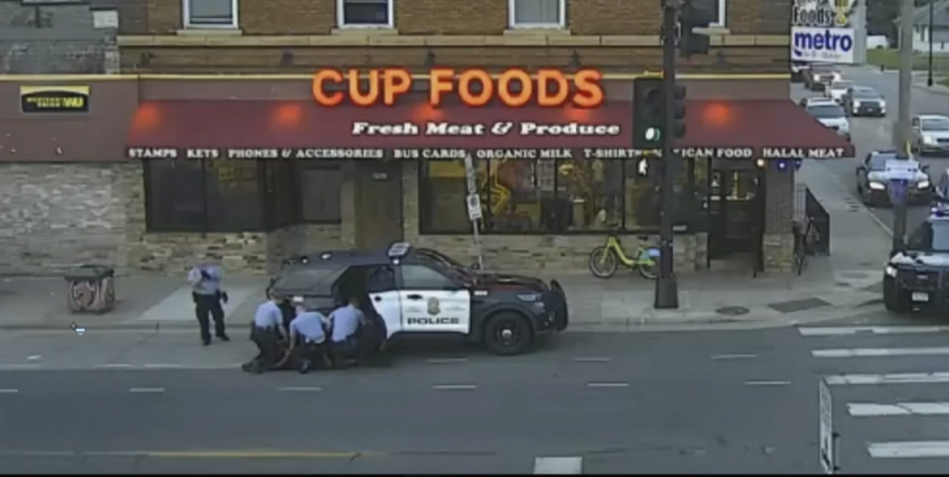 In this image from Minneapolis city surveillance video, Minneapolis police are seen attempting to take George Floyd into custody May 25, 2020, in Minneapolis, Minn. The video was shown as Hennepin County Judge Peter Cahill presides Monday, March 29, 2021, in the trial of former Minneapolis police officer Derek Chauvin, in the death of George Floyd at the Hennepin County Courthouse in Minneapolis, Minn. (