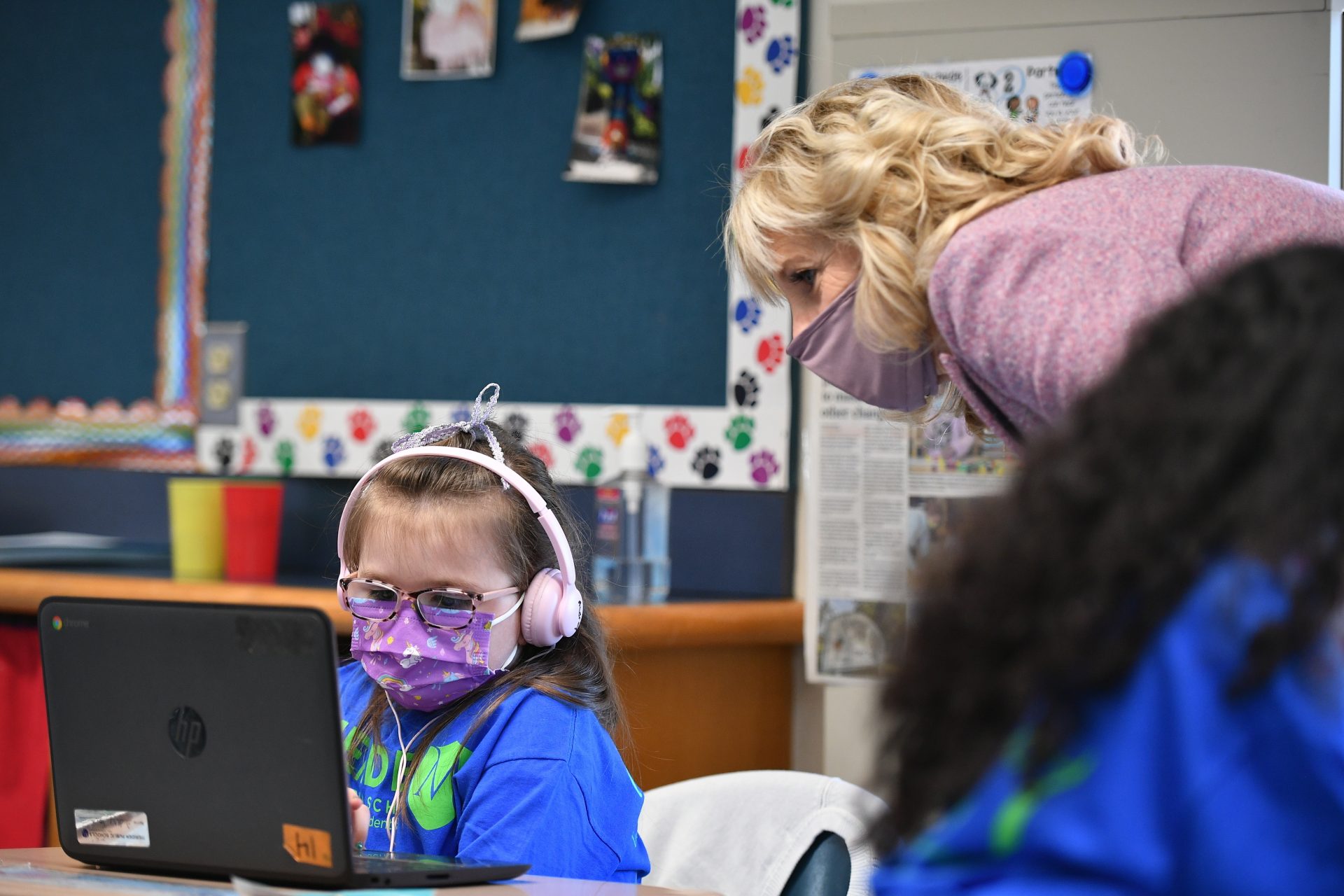 In this March 3, 2021, file photo watches a student work as she tours the Benjamin Franklin Elementary School, in Meriden, Ct.