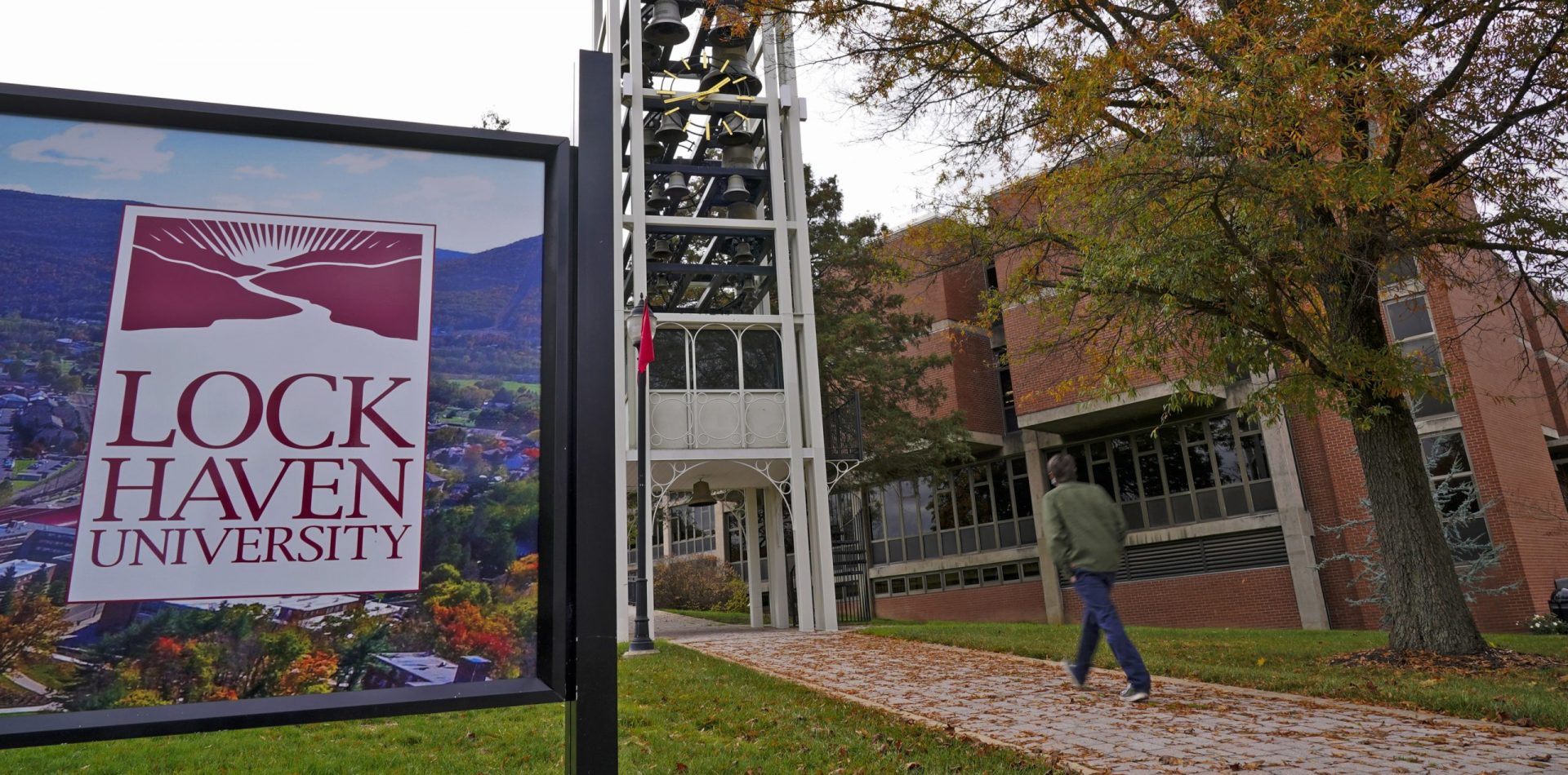 A student walks on the Lock Haven University campus in Lock Haven, Pa, Saturday, Oct. 31, 2020.