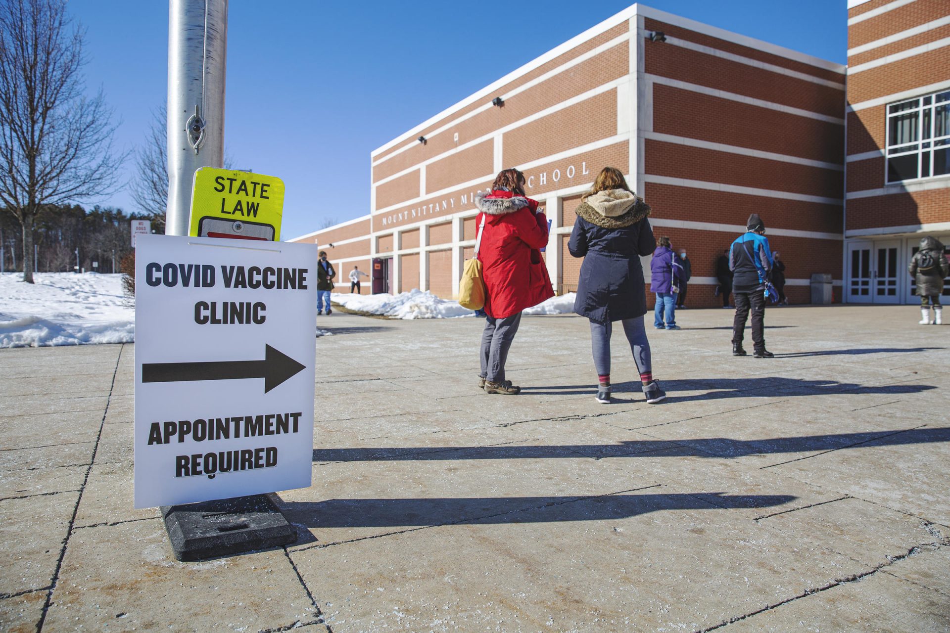 In this file photo, people lined up outside of Mount Nittany Middle School where a mass vaccination clinic was held by Centre Volunteers in Medicine.