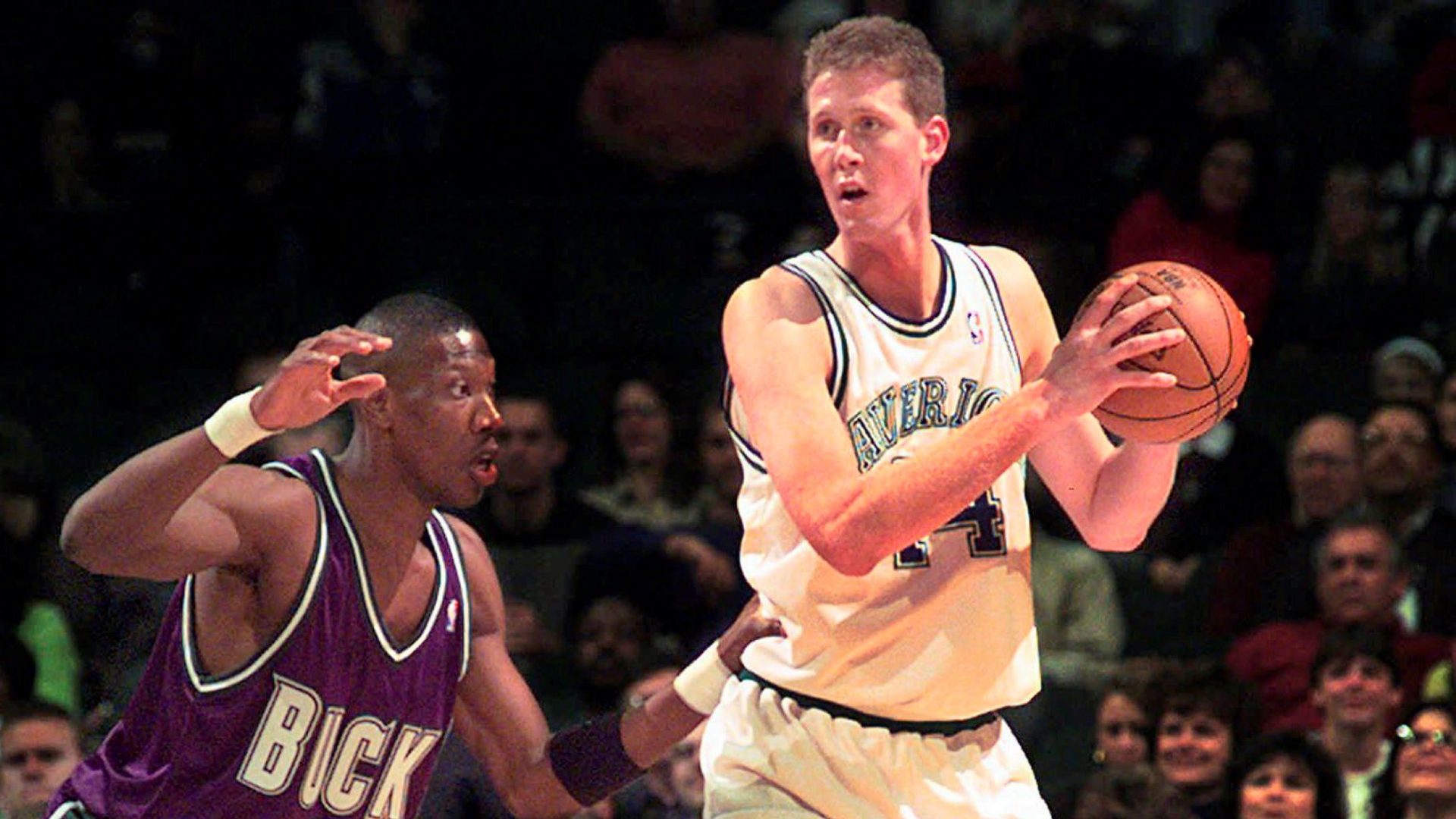 In this Nov. 22, 1997, file photo, Dallas Mavericks' Shawn Bradley (44) looks to pass as Milwaukee Bucks' Ervin Johnson (40) defends during the first quarter of an NBA basketball game at the Reunion Arena in Dallas.
