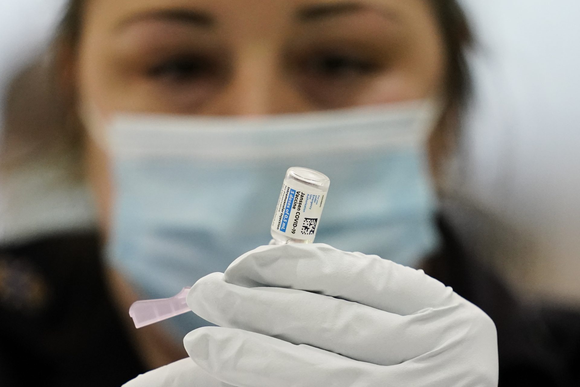 A member of the Philadelphia Fire Department prepares a dose of the Johnson & Johnson COVID-19 vaccine at a vaccination site setup at a Salvation Army location in Philadelphia, Friday, March 26, 2021.