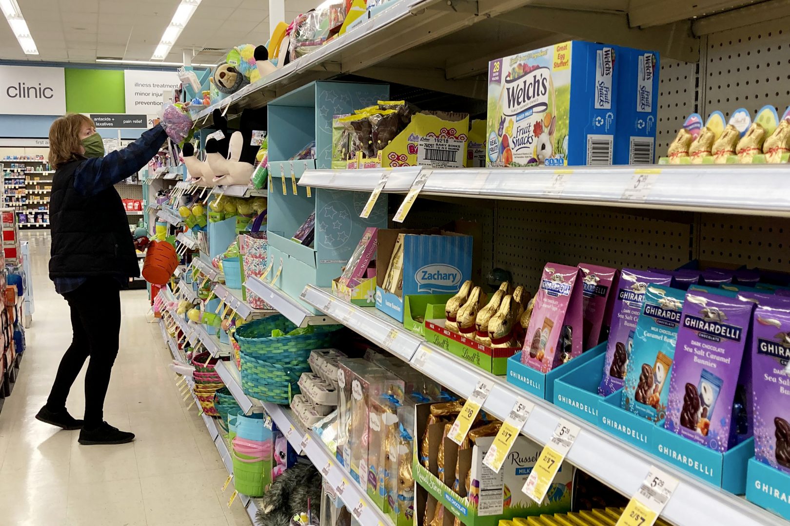 A shopper shops for Easter items at a retail store in Mount Prospect, Ill., Wednesday, March 31, 2021.