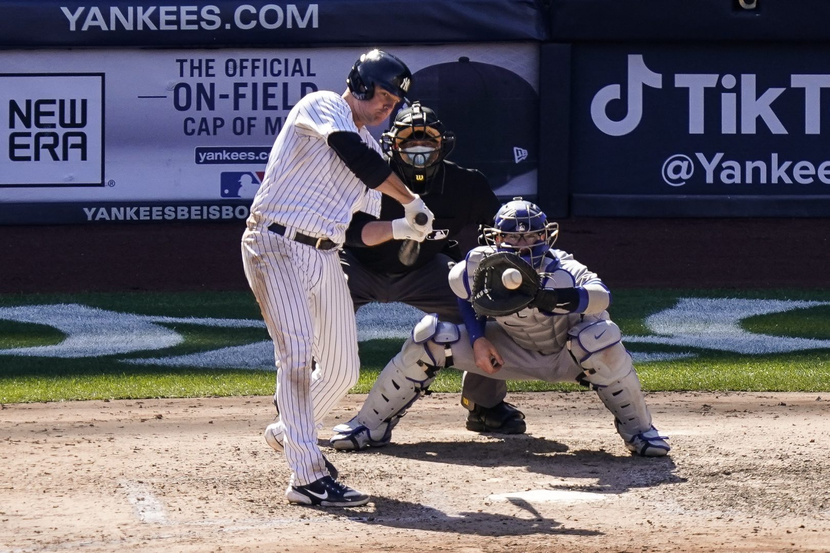 New York Yankees' Jay Bruce, left, hits a two-run single off Toronto Blue Jays relief pitcher Tim Mayza during the sixth inning of a baseball game, Saturday, April 3, 2021, in New York. (AP Photo/John Minchillo)