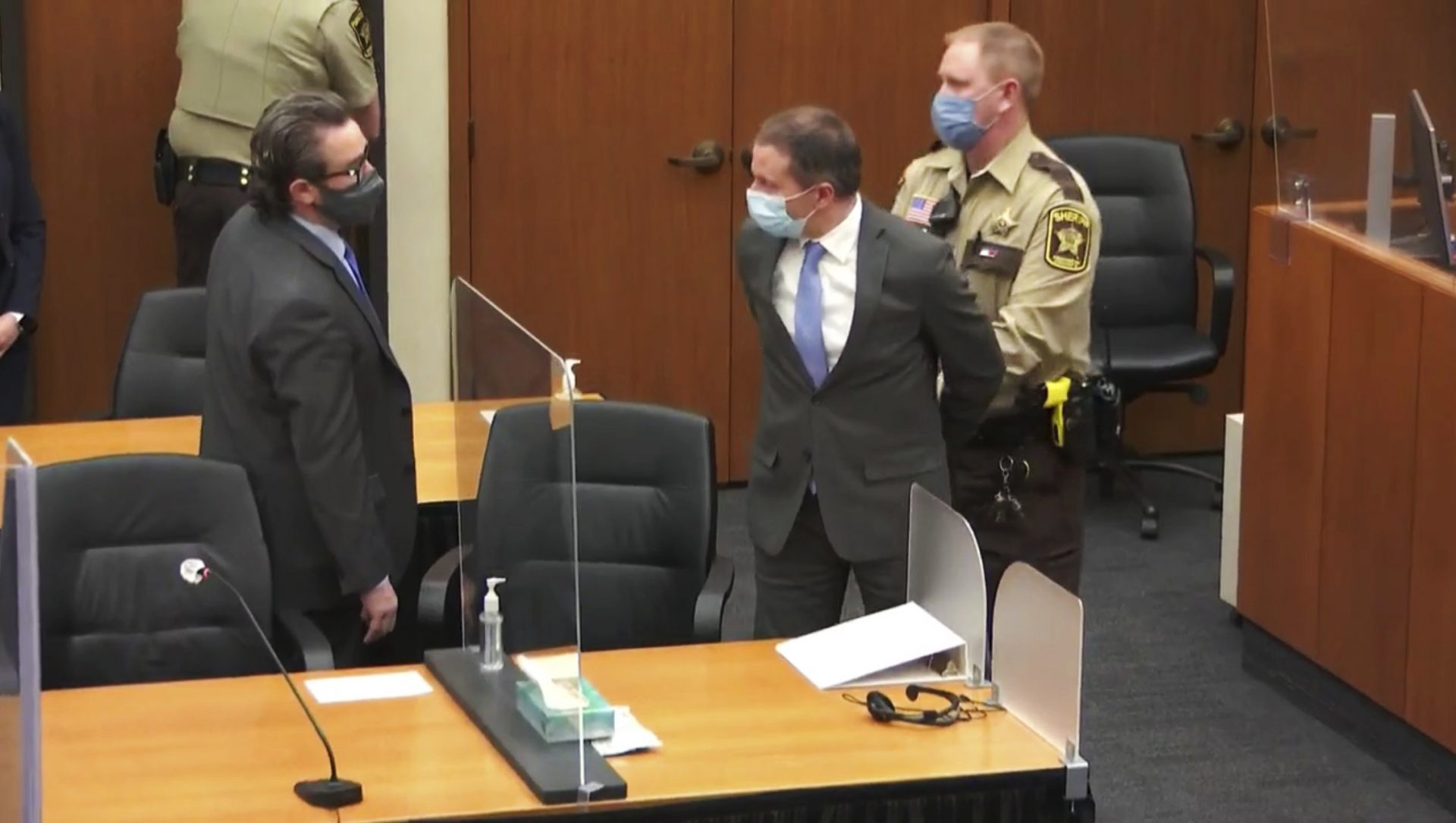 In this image from video, former Minneapolis police Officer Derek Chauvin, center, is taken into custody as his attorney, Eric Nelson, left, looks on, after the verdicts were read at Chauvin's trial for the 2020 death of George Floyd, Tuesday, April 20, 2021, at the Hennepin County Courthouse in Minneapolis, Minn.