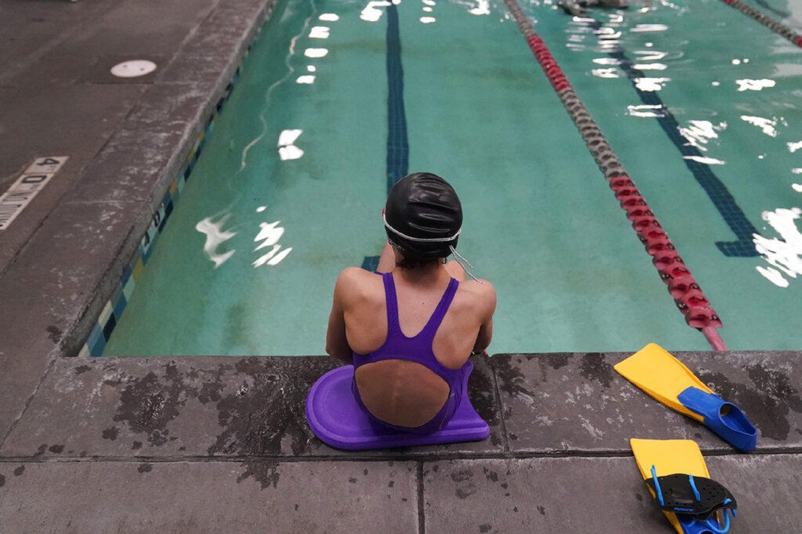 A proposed ban on transgender athletes playing female school sports in Utah would affect transgender girls like this 12-year-old swimmer seen at a pool in Utah on Feb. 22, 2021. She and her family spoke with The Associated Press on the condition of anonymity to avoid outing her publicly.