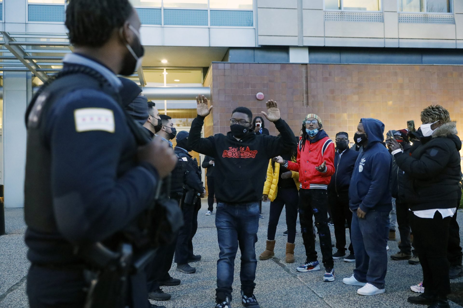 Activist Ja'Mal Green reacts as he walks towards a line of police officers outside Chicago police headquarters during a rally after the body camera video release of fatal police shooting of 13-year-old Adam Toledo on Thursday, April 15, 2021.