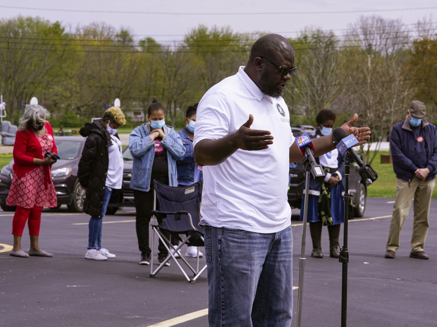 Pastor Denell Howard of the Olivet Missionary Baptist Church leads a prayer at a vigil in Indianapolis, Saturday, April 17, 2021 for the victims of the shooting at a FedEx facility. A gunman killed eight people and wounded several others before taking his own life in a late-night attack at a FedEx facility near the Indianapolis airport.  (AP Photo/Michael Conroy)