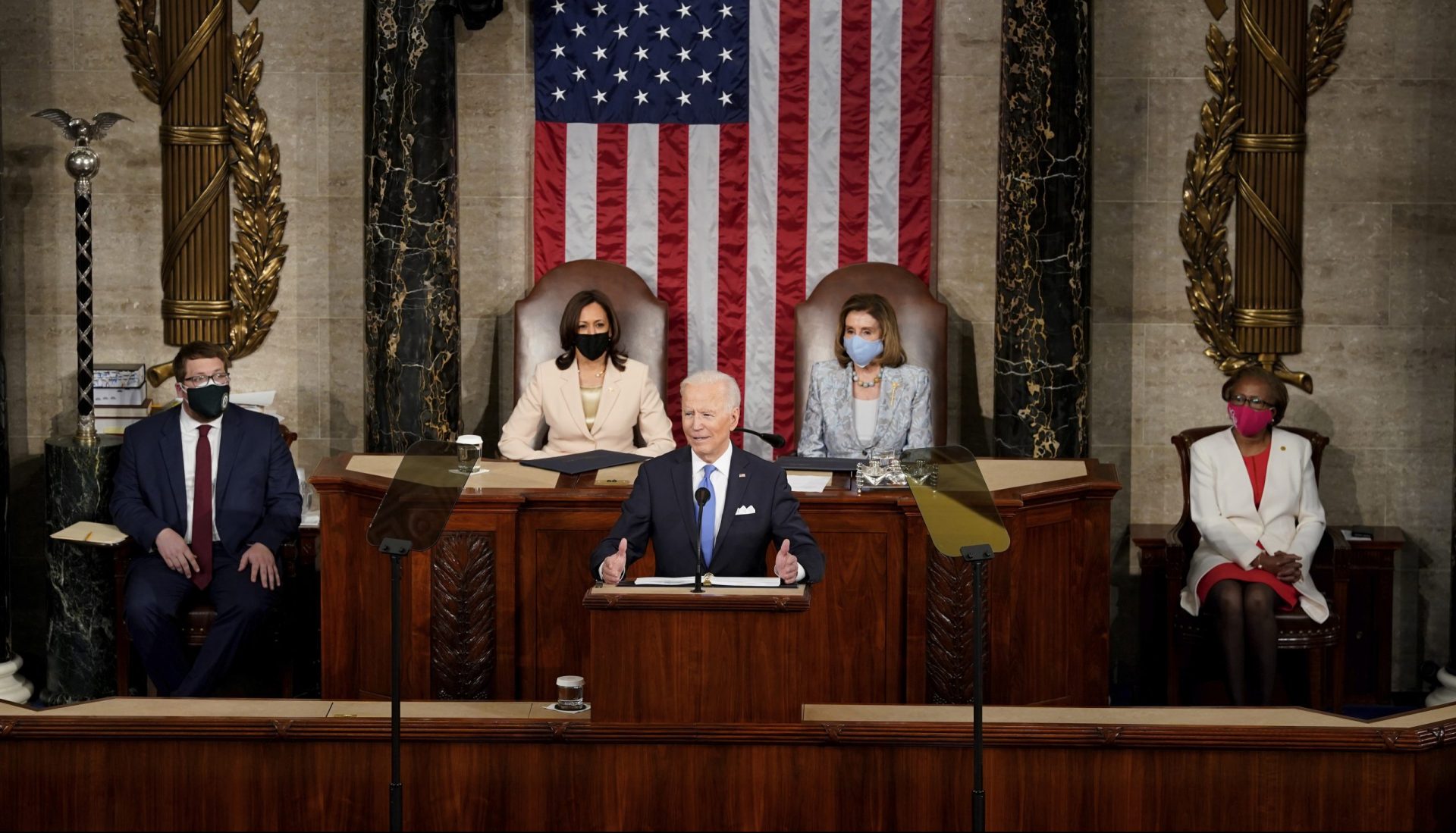 President Joe Biden speaks to a joint session of Congress Wednesday, April 28, 2021, in the House Chamber at the U.S. Capitol in Washington, as Vice President Kamala Harris and House Speaker Nancy Pelosi of Calif., listen.