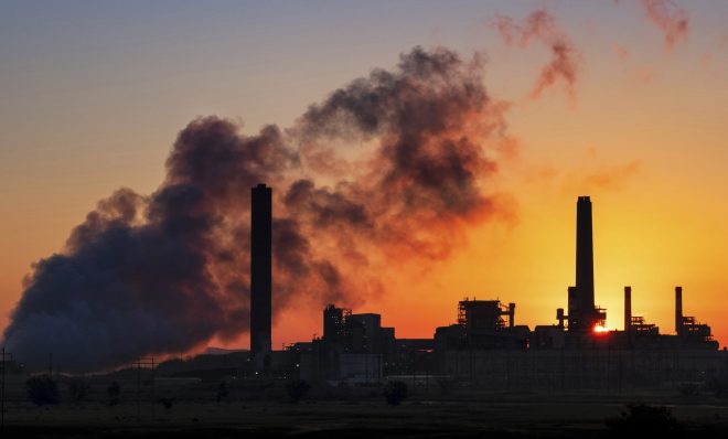  In this July 27, 2018, file photo, the Dave Johnson coal-fired power plant is silhouetted against the morning sun in Glenrock, Wyo.   