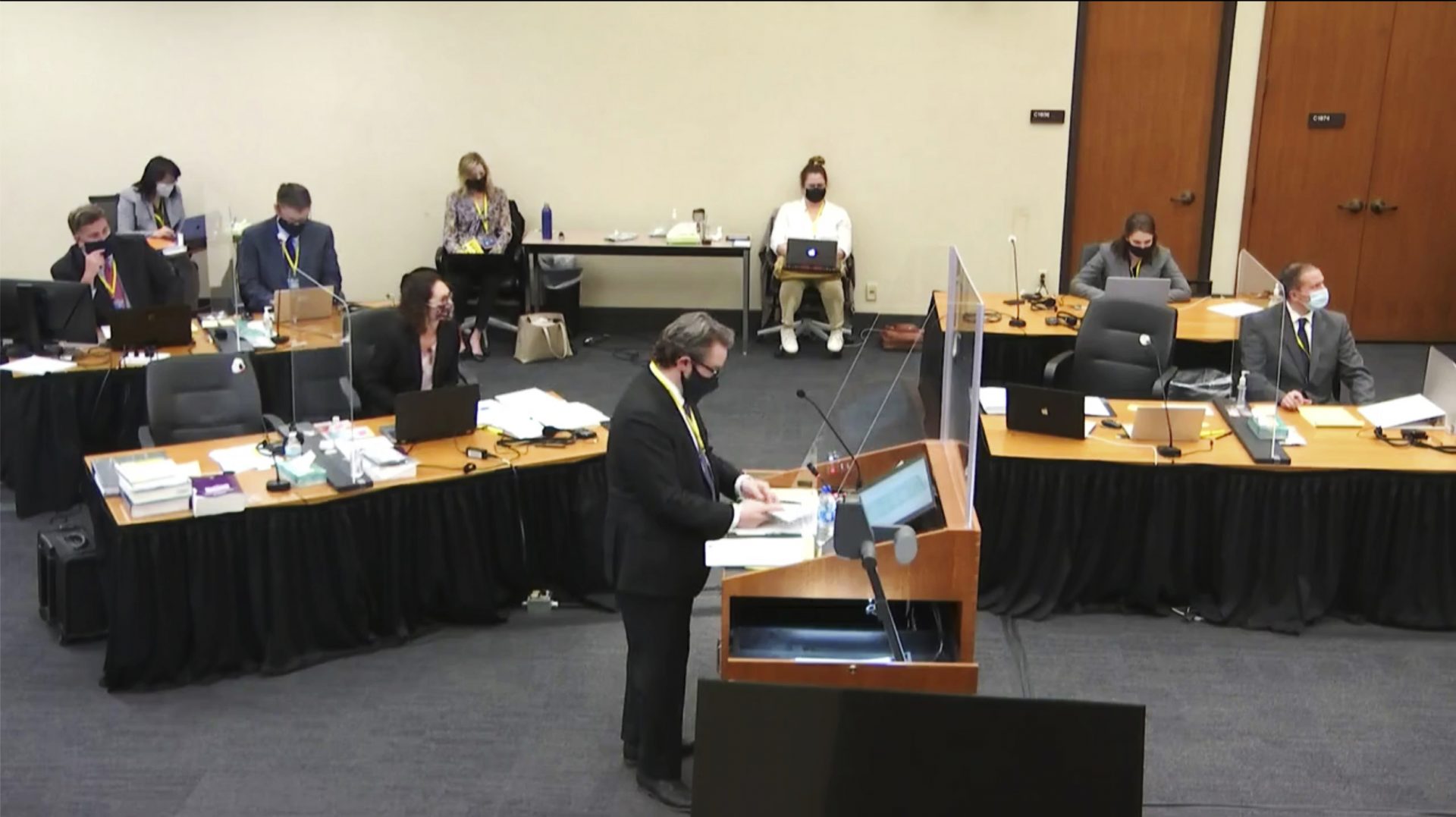 In this image taken from video, defense attorney Eric Nelson questions witness Daniel Isenschmid, a forensic toxicologist as Hennepin County Judge Peter Cahill presides Thursday, April 8, 2021, in the trial of former Minneapolis police Officer Derek Chauvin at the Hennepin County Courthouse in Minneapolis, Minn. Chauvin is charged in the May 25, 2020 death of George Floyd.