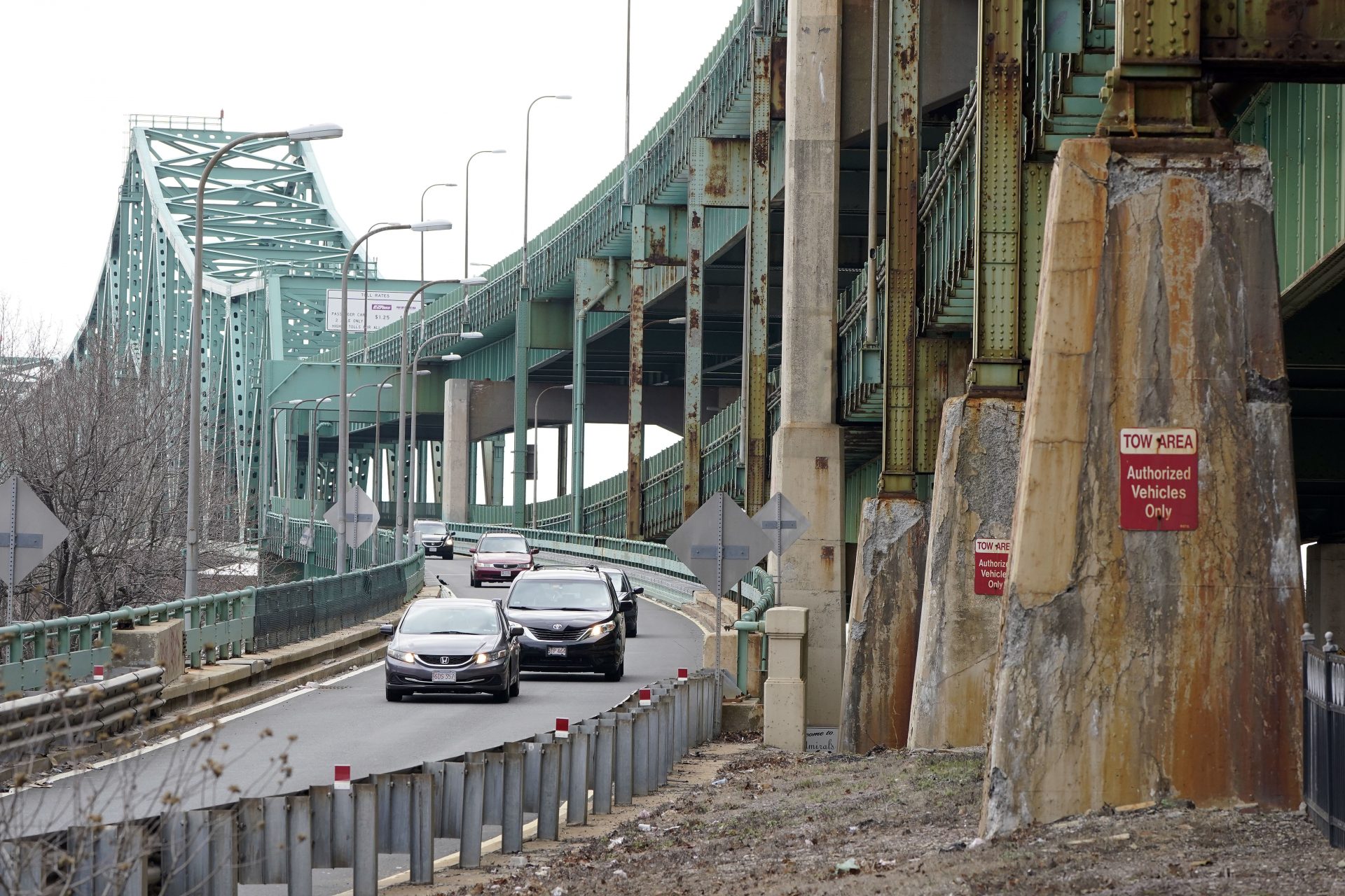 Drivers take an exit ramp off the Tobin Memorial Bridge, Wednesday, March 31, 2021, in Chelsea, Mass. President Joe Biden wants $2 trillion to reengineer America's infrastructure and expects the nation's corporations to pay for it. The Tobin Bridge spans the Mystic River and links Boston and Chelsea.