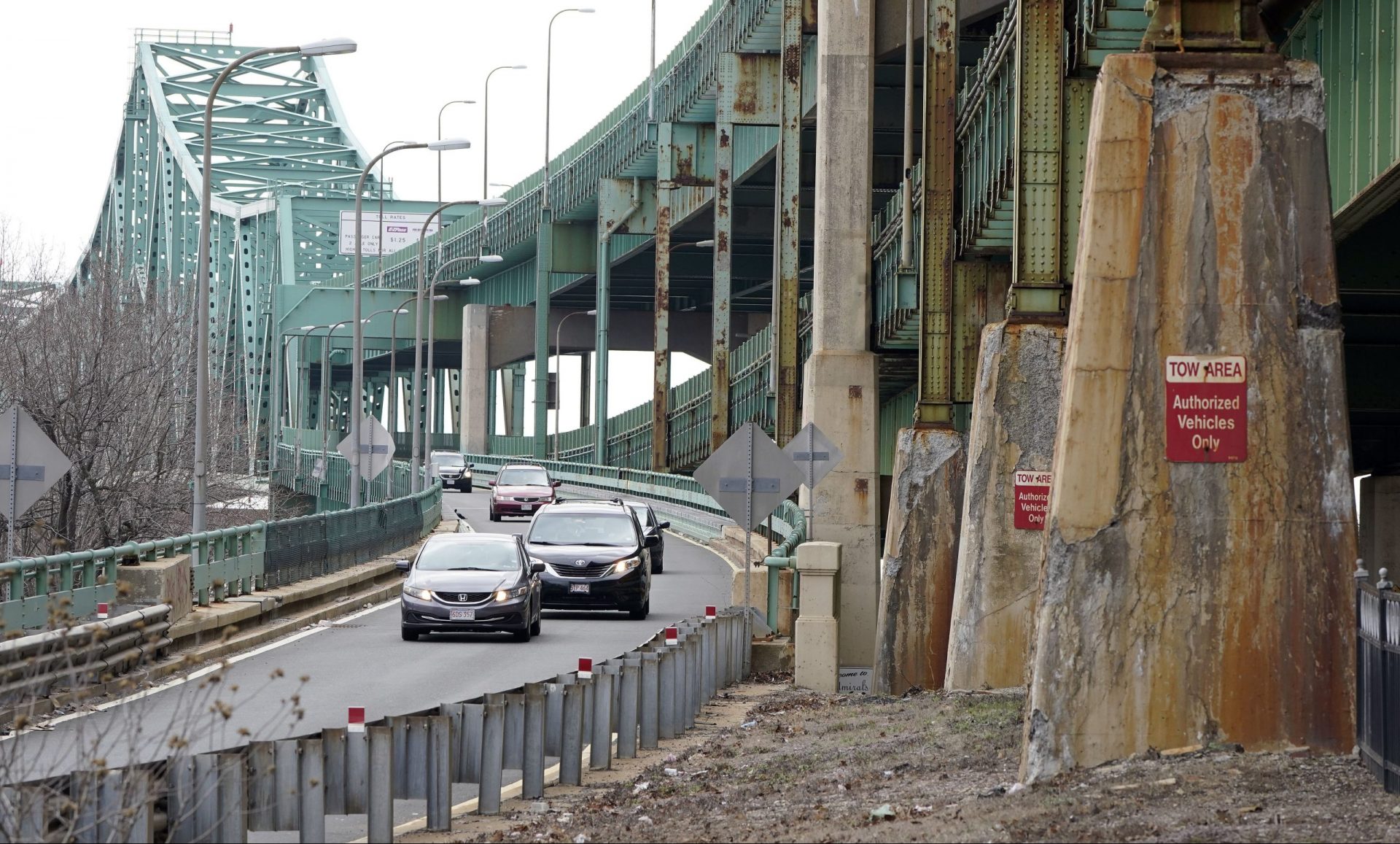 Drivers take an exit ramp off the Tobin Memorial Bridge, Wednesday, March 31, 2021, in Chelsea, Mass. President Joe Biden wants $2 trillion to reengineer America's infrastructure and expects the nation's corporations to pay for it. The Tobin Bridge spans the Mystic River and links Boston and Chelsea.
