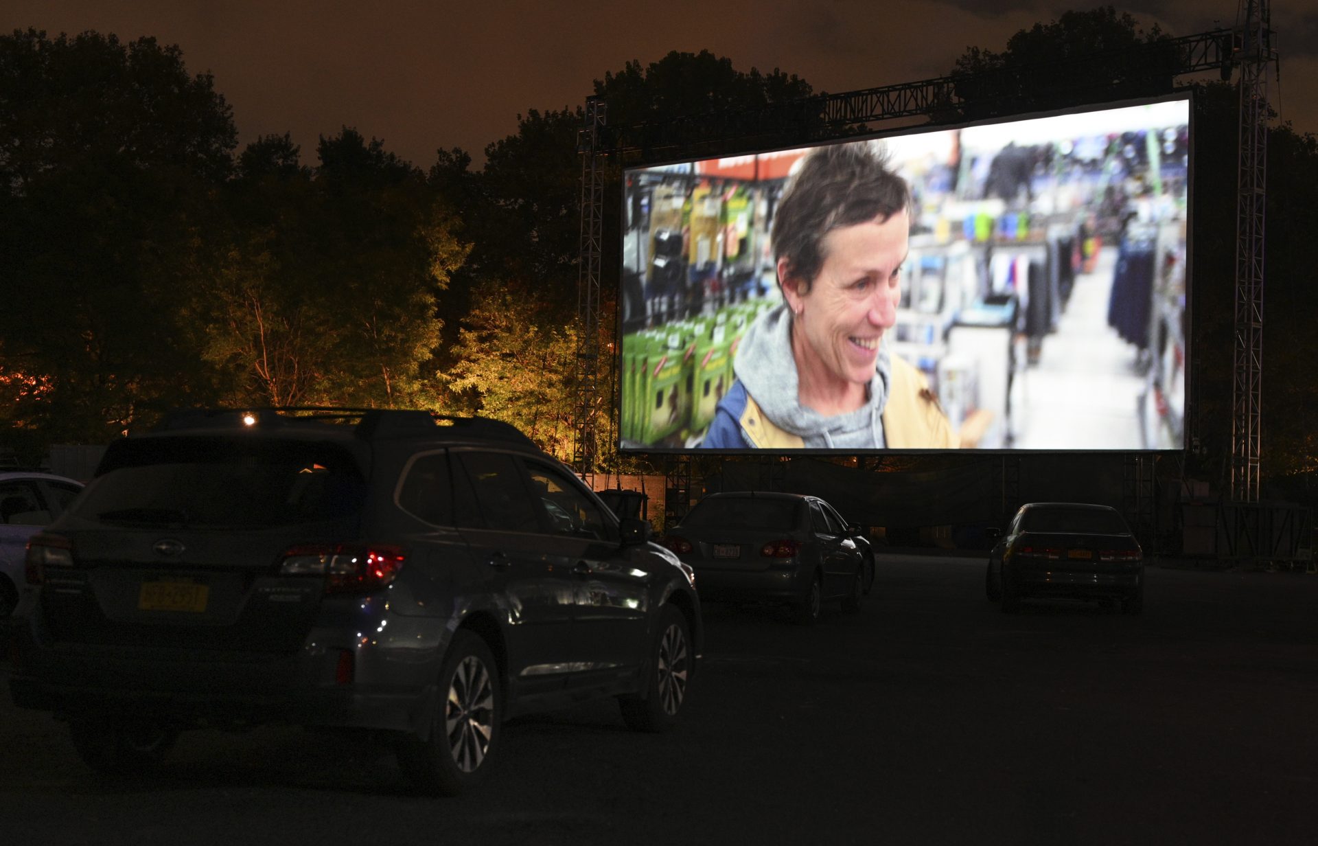 Filmgoers attend the "Nomadland" screening at the Queens Drive-In at the New York Hall of Science during the 58th New York Film Festival on Saturday, Sept. 26, 2020, in New York.