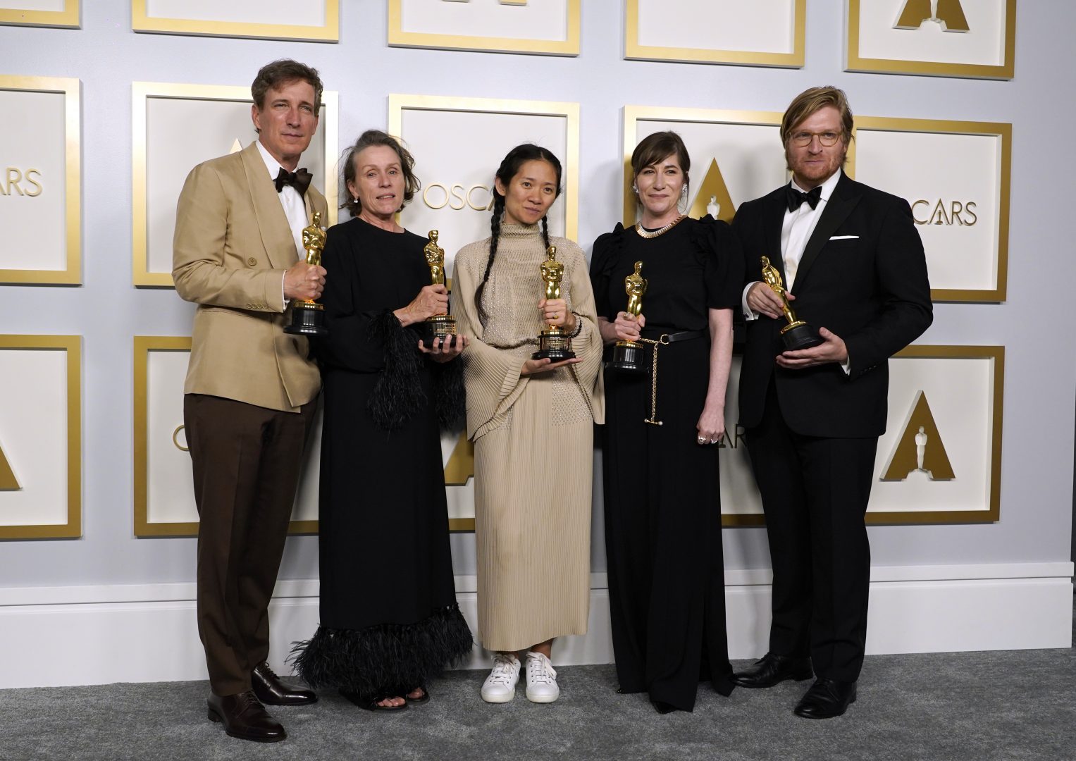 Producers Peter Spears, from left, Frances McDormand, Chloe Zhao, Mollye Asher and Dan Janvey, winners of the award for best picture for 