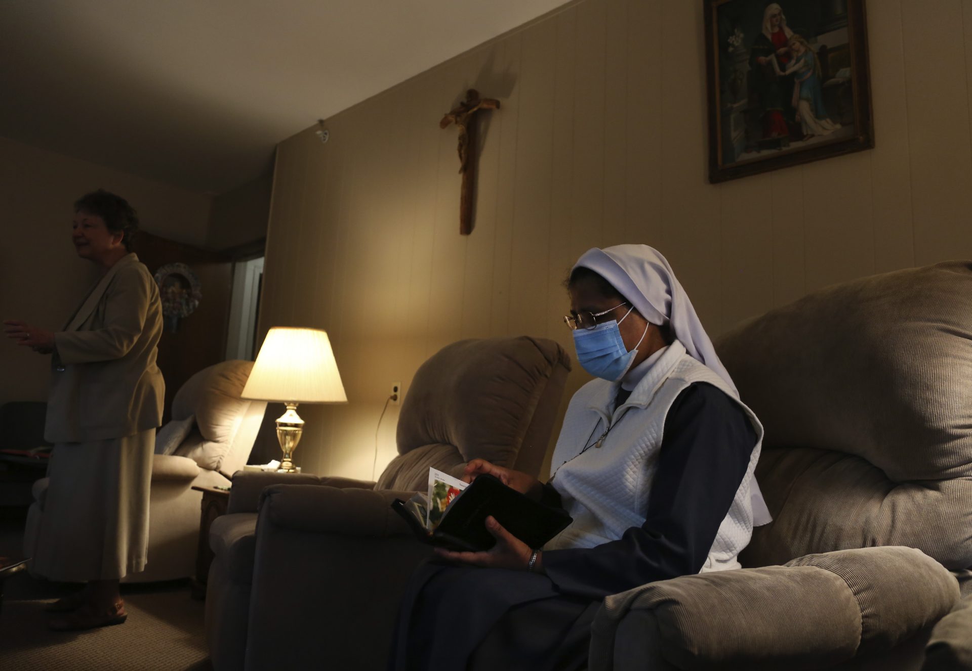 Sister Rose Nellivila sits for morning prayer at St. Anne Home in Greensburg, Pa., where she serves as a nurse for residents of the nursing facility, on Thursday, March 25, 2021.
