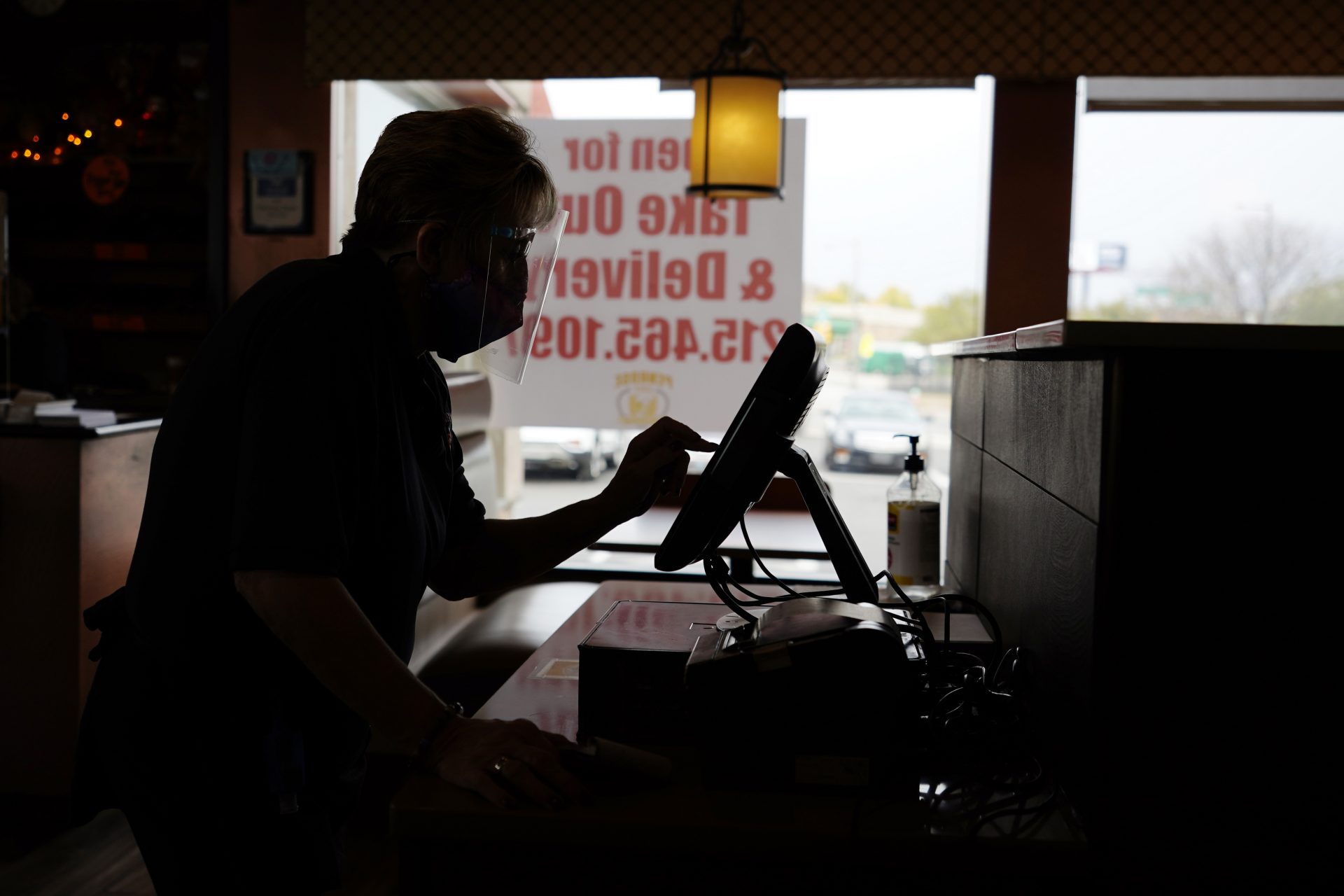 Waitress Donna McNamee enters an order at the Penrose Diner, Tuesday, Nov. 17, 2020, in south Philadelphia.